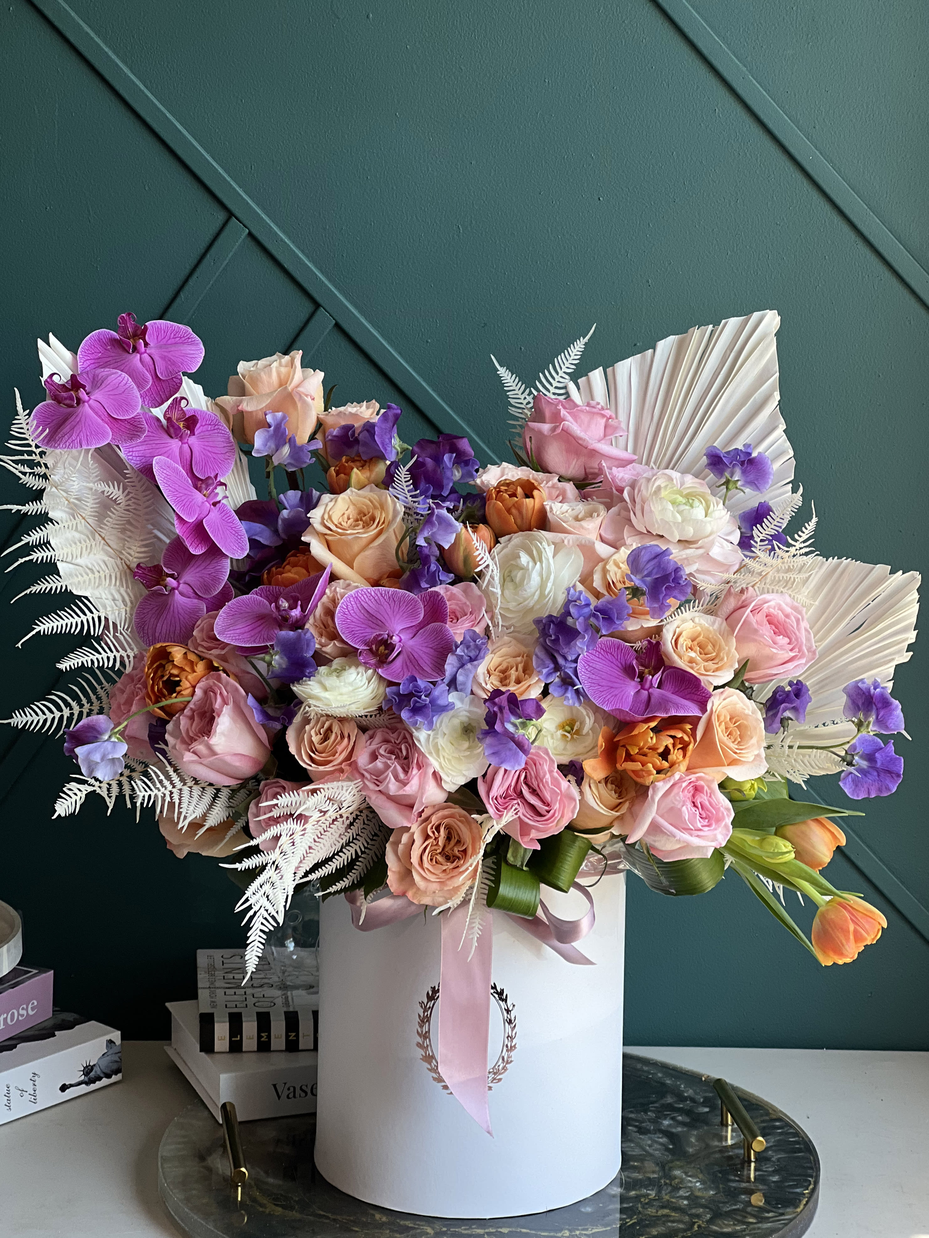 VIVID GARDEN | BOX WITH FLOWERS - Luxurious arrangement full with flowers.  Includes roses, garden roses, tulips, ranunculus, phalaenopsis orchids, mixed seasonal flowers and dry leaves. 