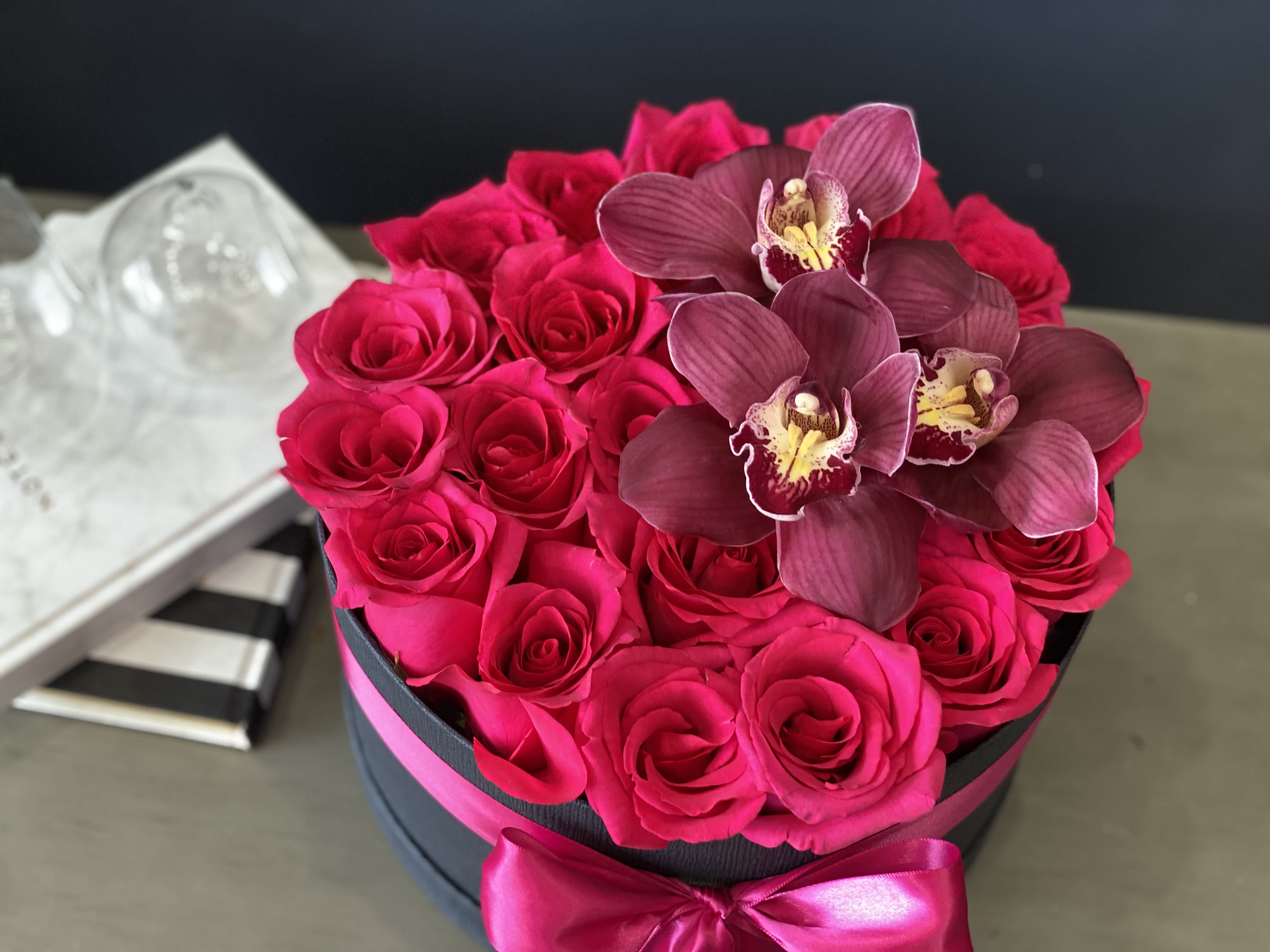 Two Dozen Hot Pink roses with orchids  - Two Dozen Hot Pink roses with orchids  in round box 