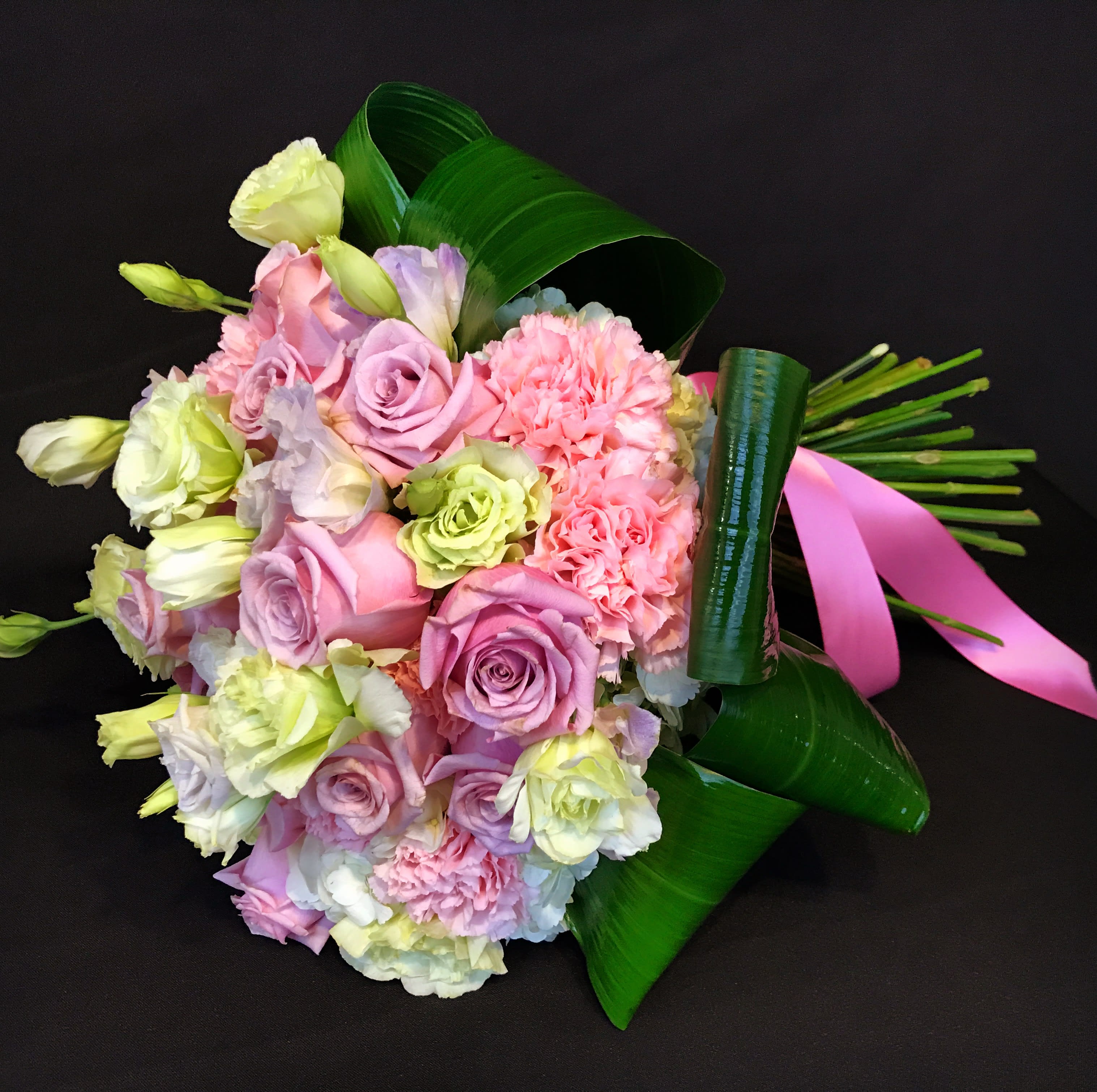Hand crafted flower bouquet  - Elegant hand crafted bouquet with roses, Lisianthus, carnations and mix flowers and greenery. 