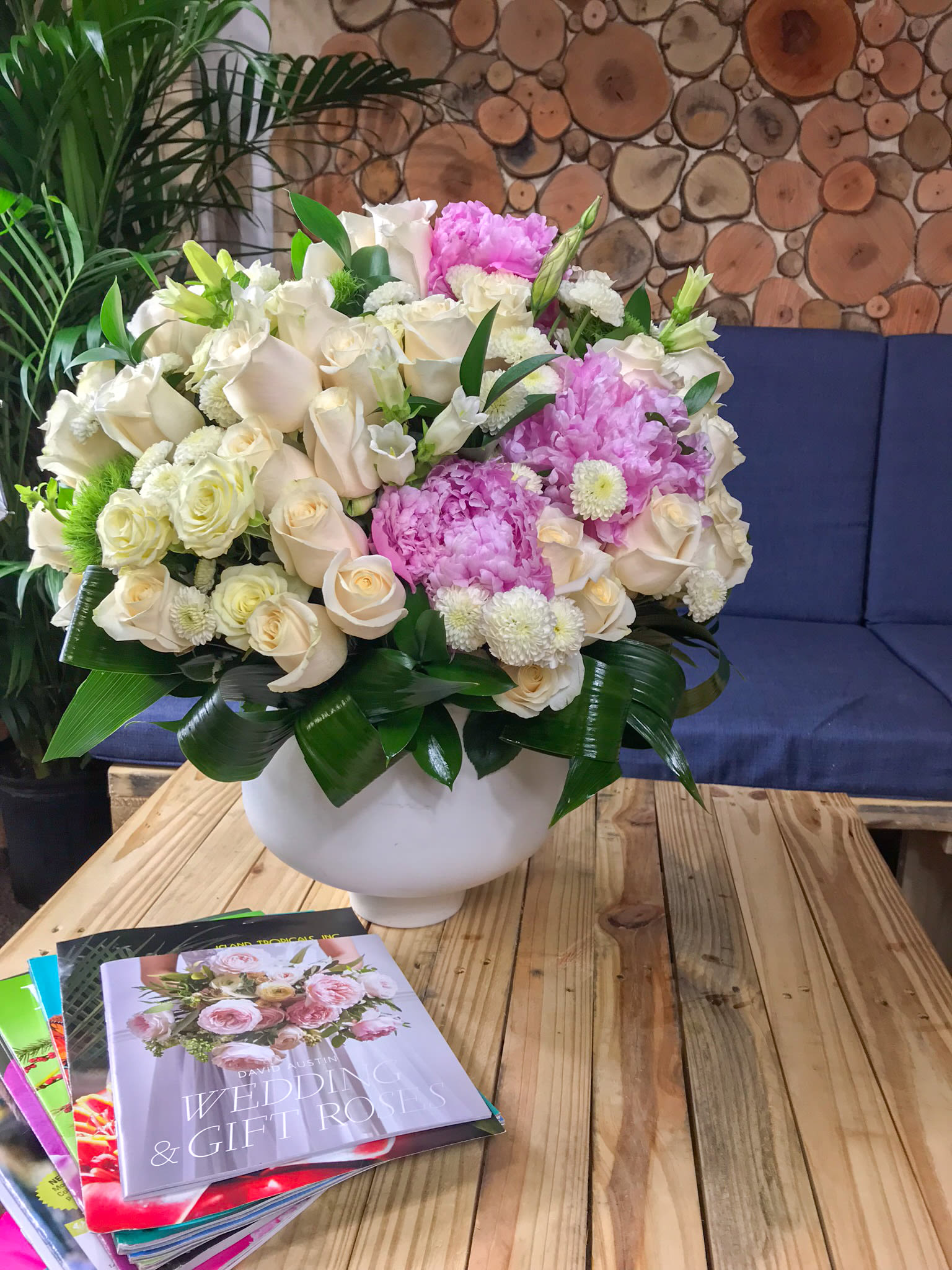 Sophisticated, luxury  flower arrangement - Extra large flower arrangement with 75 stems of white roses, 30 stems of spray roses, peonies and mix seasonal,flowers. Arranged in white ceramic vase.  Perfect present for any person or occasion! 