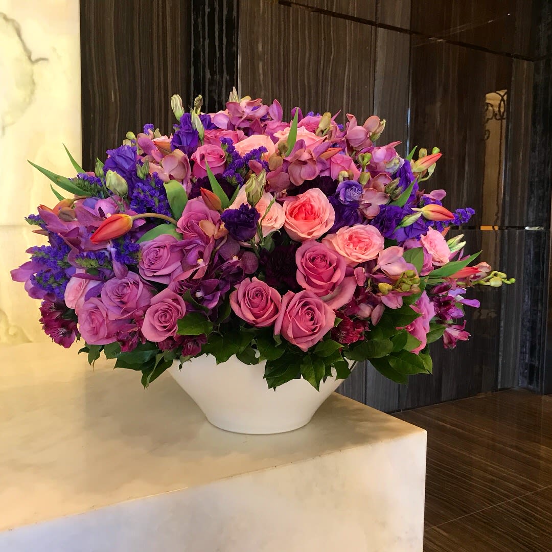 Exclusive Flower Design  - Grand, luxurious flower design with roses, tulips, orchids, peonies and mix flowers in white ceramic pot   Size : Extra Large