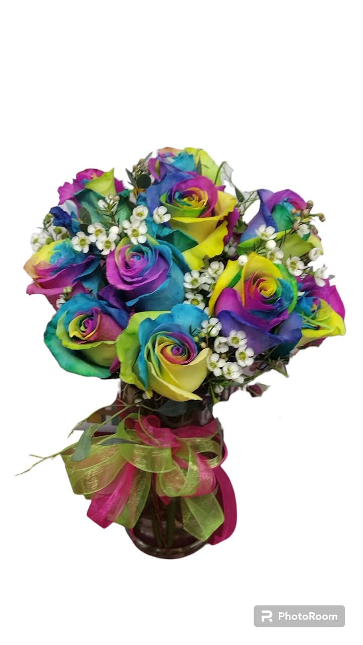Groovy Blossom Vibe Vase - Get ready to spread some flower power with our groovy blossom vibe vase! This vibrant vase is bursting with stunning tie dye roses, each petal a kaleidoscope of colors that dance in the light. Paired with delicate greens &amp; filler, this floral masterpiece is not just a gift; it's a celebration of love and joy that will leave your loved ones smiling and feeling oh-so-special. Perfect for any occasion, let these colorful beauties brighten up your space and your heart! Please note these are special order. 