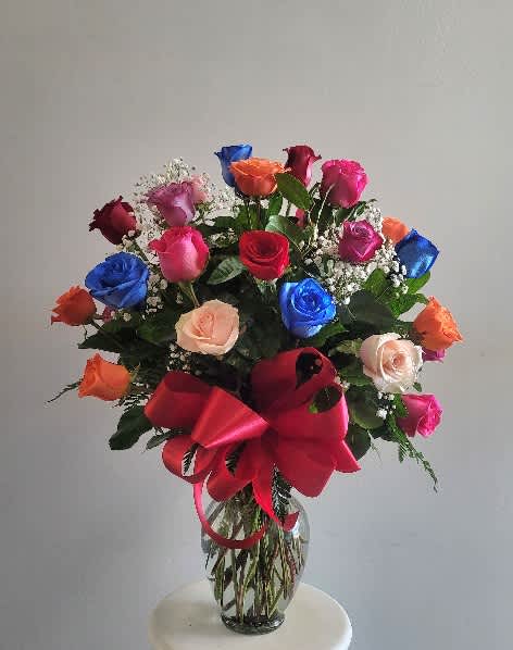 24 mixed color roses by Xochitl Flowers EP 24 mixed color roses by Xochitl Flowers EP - Beautiful multicolor rose vase arrangement for any occasion.