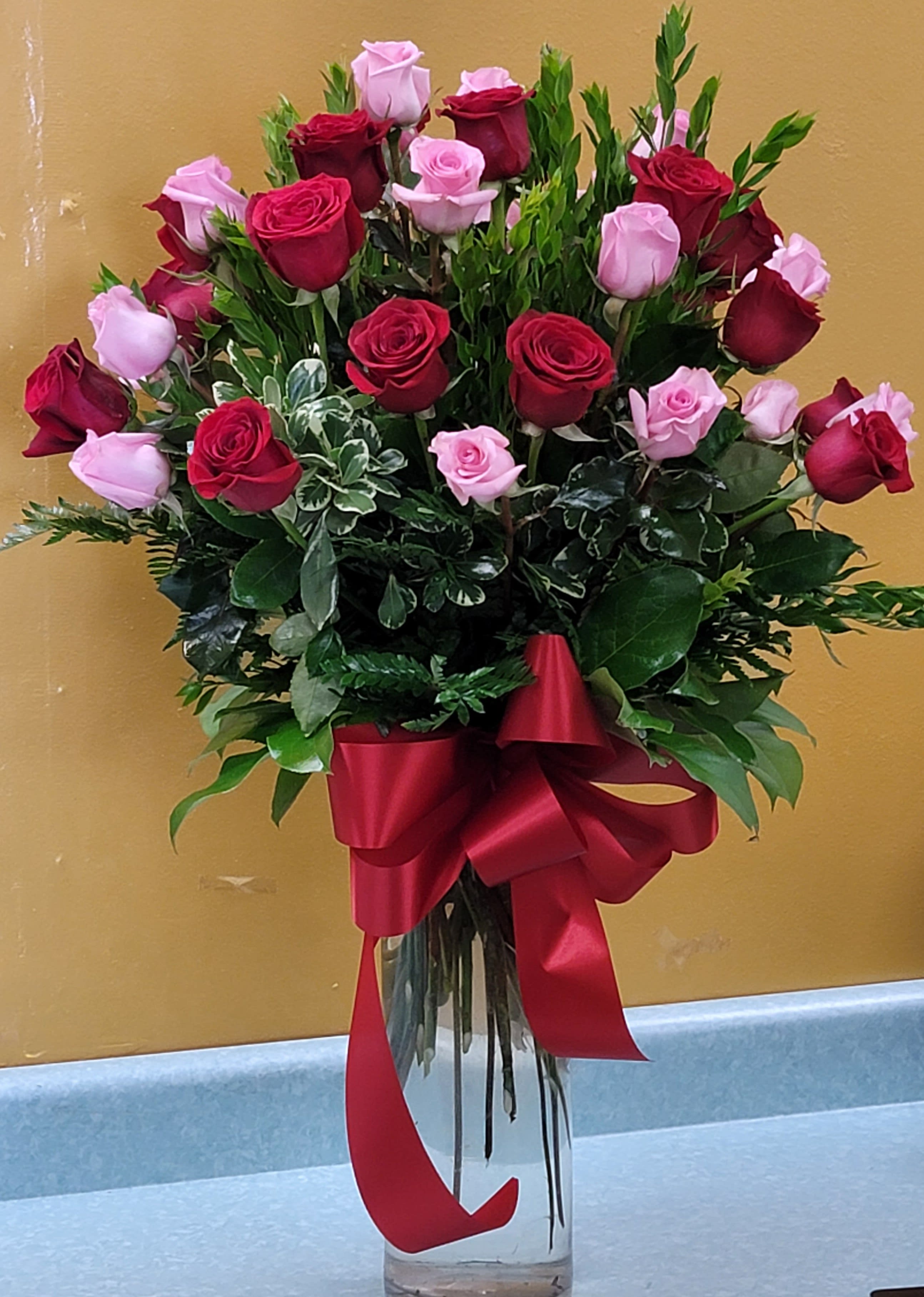 36 PINK AND RED ROSES BY Xochitl Flowers EP - DESINGNED IN A 16&quot; CILYNDRIC VASE WITH GREENERY, FILLER AND MATCHING BOW