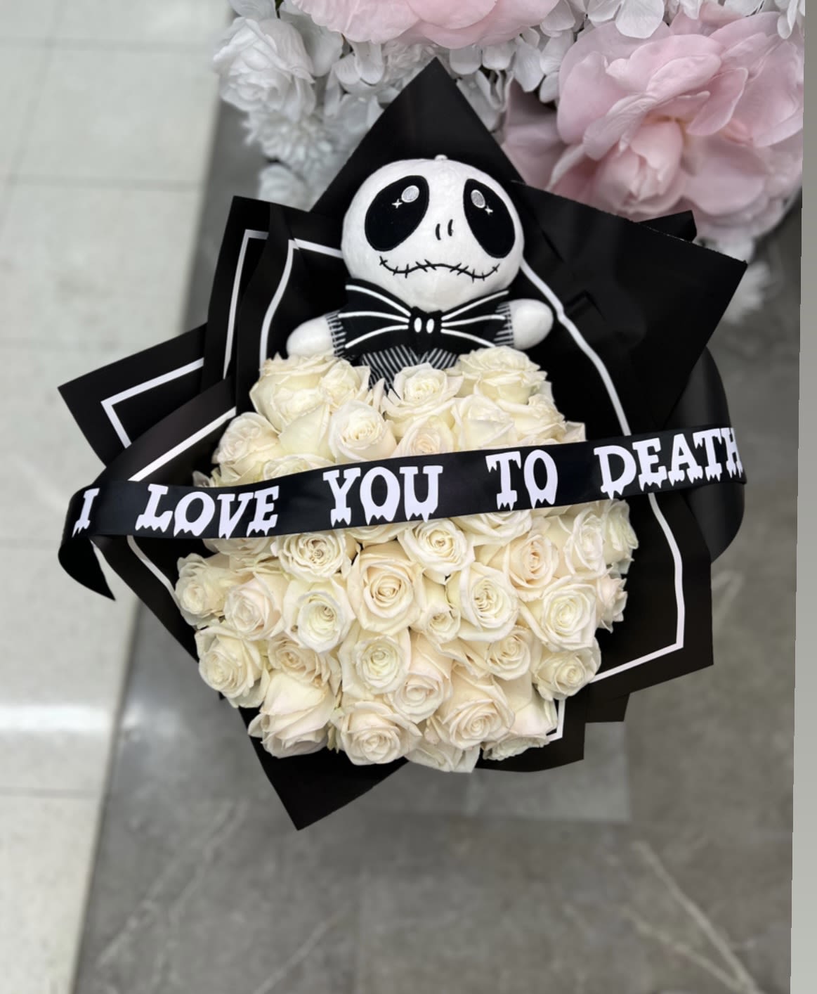 Jack Inspired bouquet  - This bouquet comes with the plushy ,  The ribbon , let me know what message you would like in the ribbon in the notes section if you do not select anything we will add I love you to death letters on the ribbon, just  like the picture.  Standard size 25 roses  Deluxe size 50 roses Premium size 100 roses 