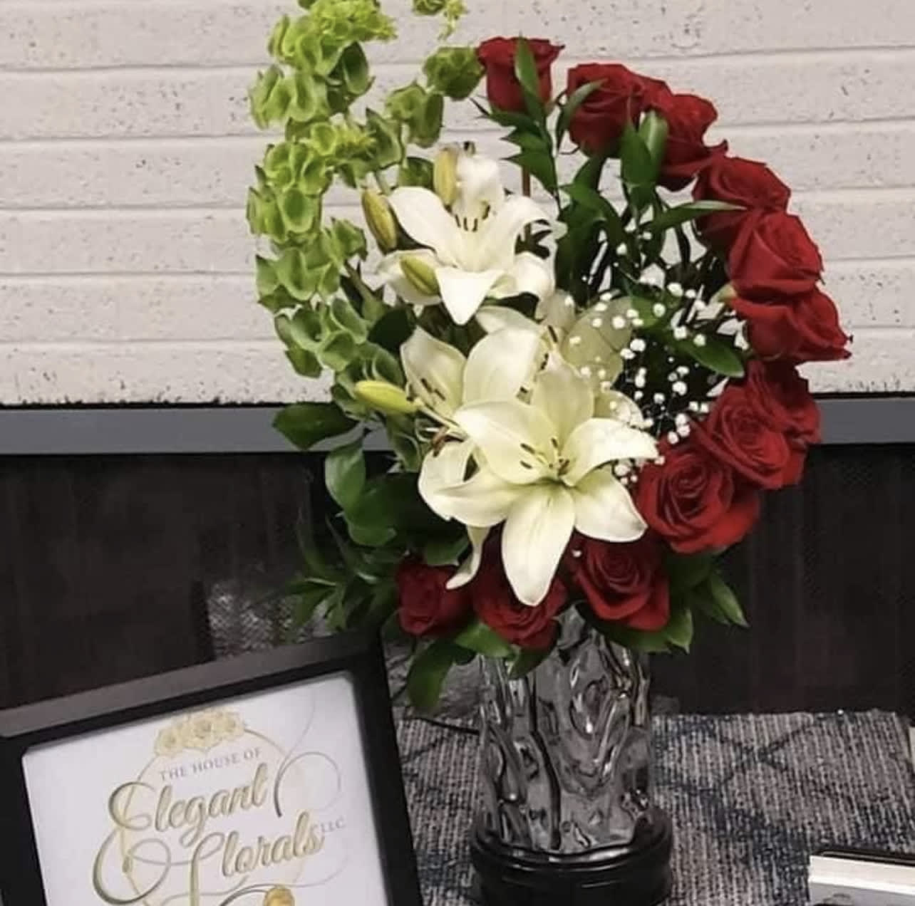 The spiraling Rose arrangement - This breathtaking unique design is very popular. It gives style to any setting.