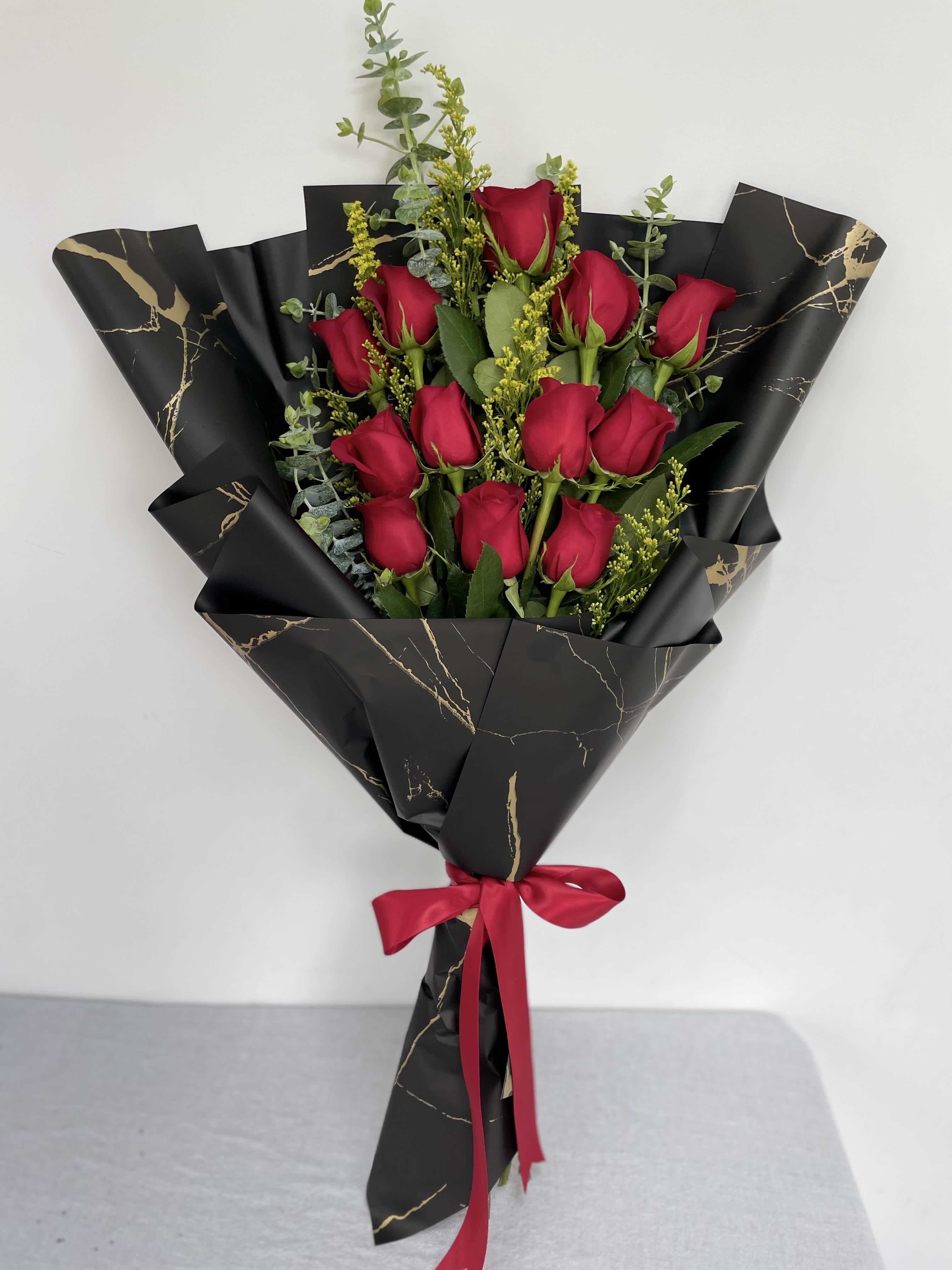 12 Wrapped Roses 12 Wrapped Roses - 1 Dozen long stem red roses wrapped