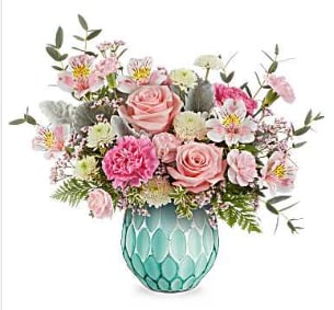 Dream in Color - Evoking the beauty of dreams in color, this enchanting rose bouquet is showcased in a frosted turquoise vase with a mercury-inspired finish and sculpted details, guaranteed to brighten any day!  This arrangement features pink roses, alstroemeria, carnations, white chrysanthemums, and pink limonium, accented with dusty miller, eucalyptus, fern, and oregonia. Delivered in Teleflora's Dream In Color Vase , which doubles as a lovely votive or decorative piece. (while supplies last) 