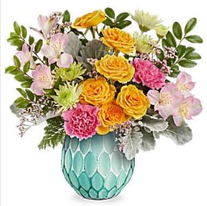 Meadow Brilliance - Brimming with lovely blossoms now and radiating warmth with a votive candle later, this enchanting turquoise vase boasts a mercury-inspired finish and sculpted details, making it a stunning gift.  This vibrant bouquet features yellow spray roses, pink alstroemeria, hot pink carnations, green cushion spray chrysanthemums, and pink limonium, beautifully accented with dusty miller, huckleberry, and leatherleaf fern. Teleflora's Meadow Brilliance Bouquet is presented in Teleflora's Dream In Color Vase (while supplies last). 
