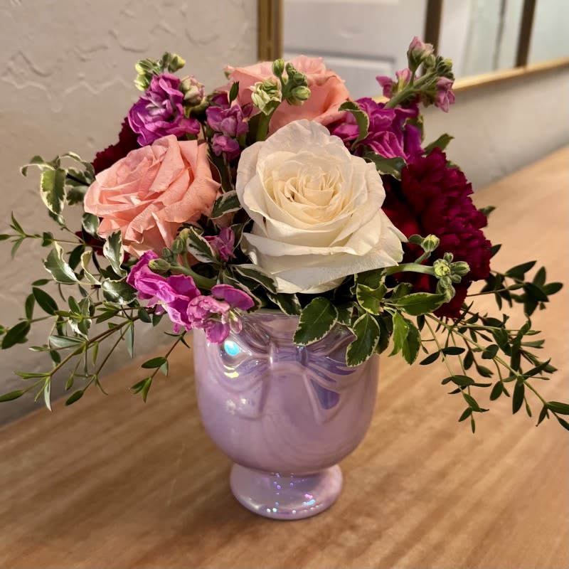 Bitty Blooms - Bitty Blooms is a petite assortment of colorful blooms in an iridescent ceramic vase. This makes a fun gift for a daughter or granddaughter. Surprise your loved one today with Bitty Blooms.