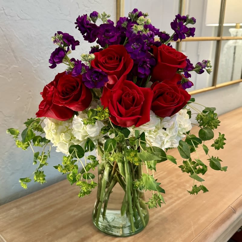 Sylvia's Stems Sylvia's Stems - Sylvia's Stems is a great gift for Valentine's Day, a birthday, an anniversary, or a romantic gesture. Includes white hydrangea, red roses, purple stock, & seeded eucalyptus.