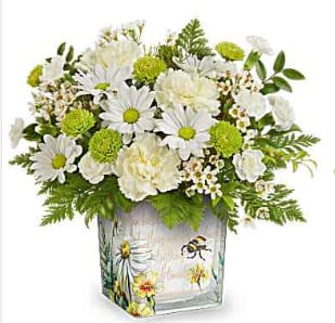 Bee Sweet Bouquet - Celebrate them with this captivating white, light yellow, and green bouquet, elegantly presented in a keepsake glass cube decorated with a charming buzzing bee design.  This arrangement features light yellow carnations, white miniature carnations, green button spray chrysanthemums, white daisy spray chrysanthemums, and white waxflower, beautifully complemented by huckleberry and leatherleaf fern. Teleflora's Bee Sweet Bouquet is presented in Teleflora's Floral Buzz Cube, a perfect unique piece! While supplies last.