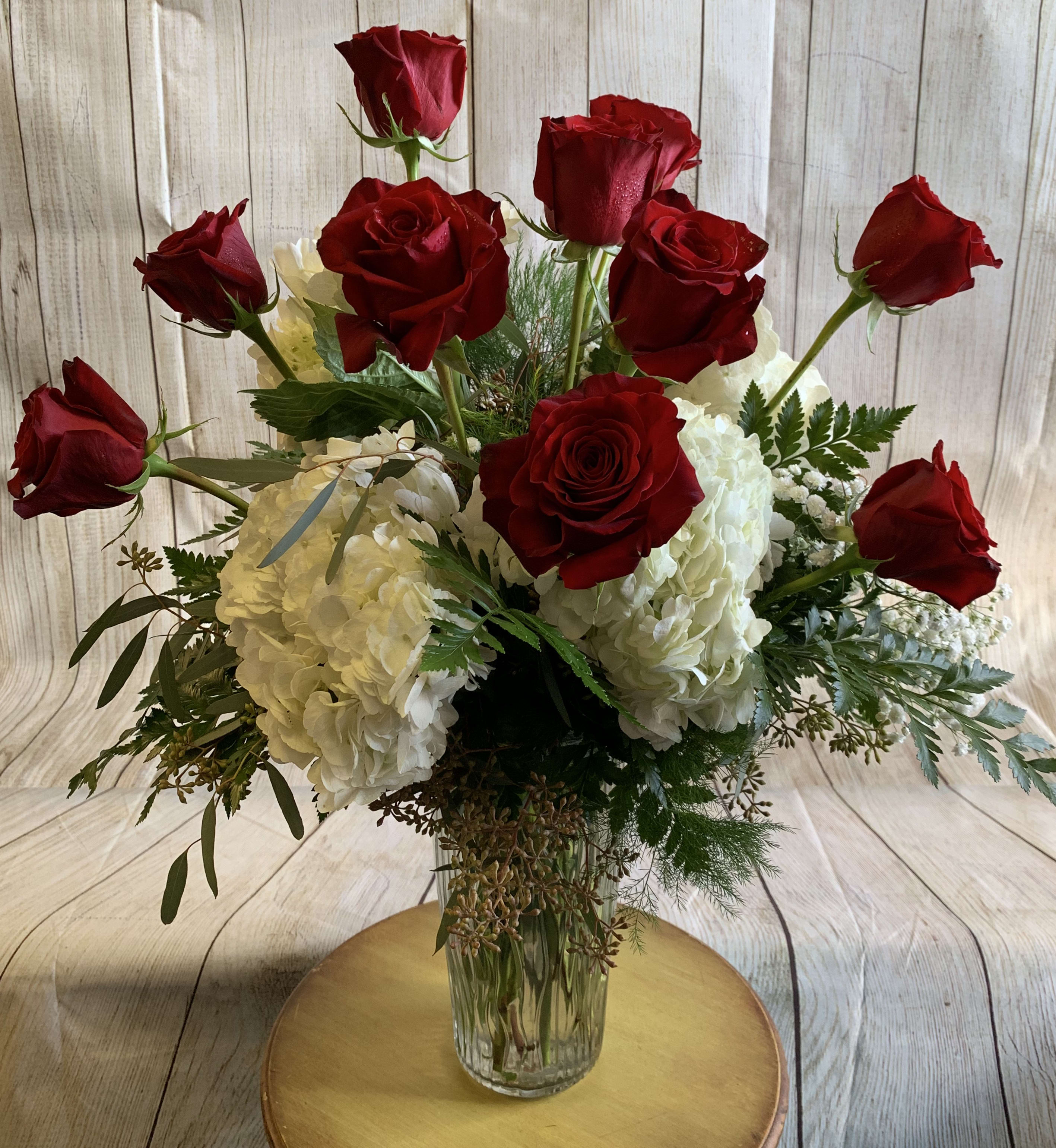 Fire & Ice Fire & Ice - White Hydrangeas compliment a traditional dozen of Red Roses! Exquisite beauty.