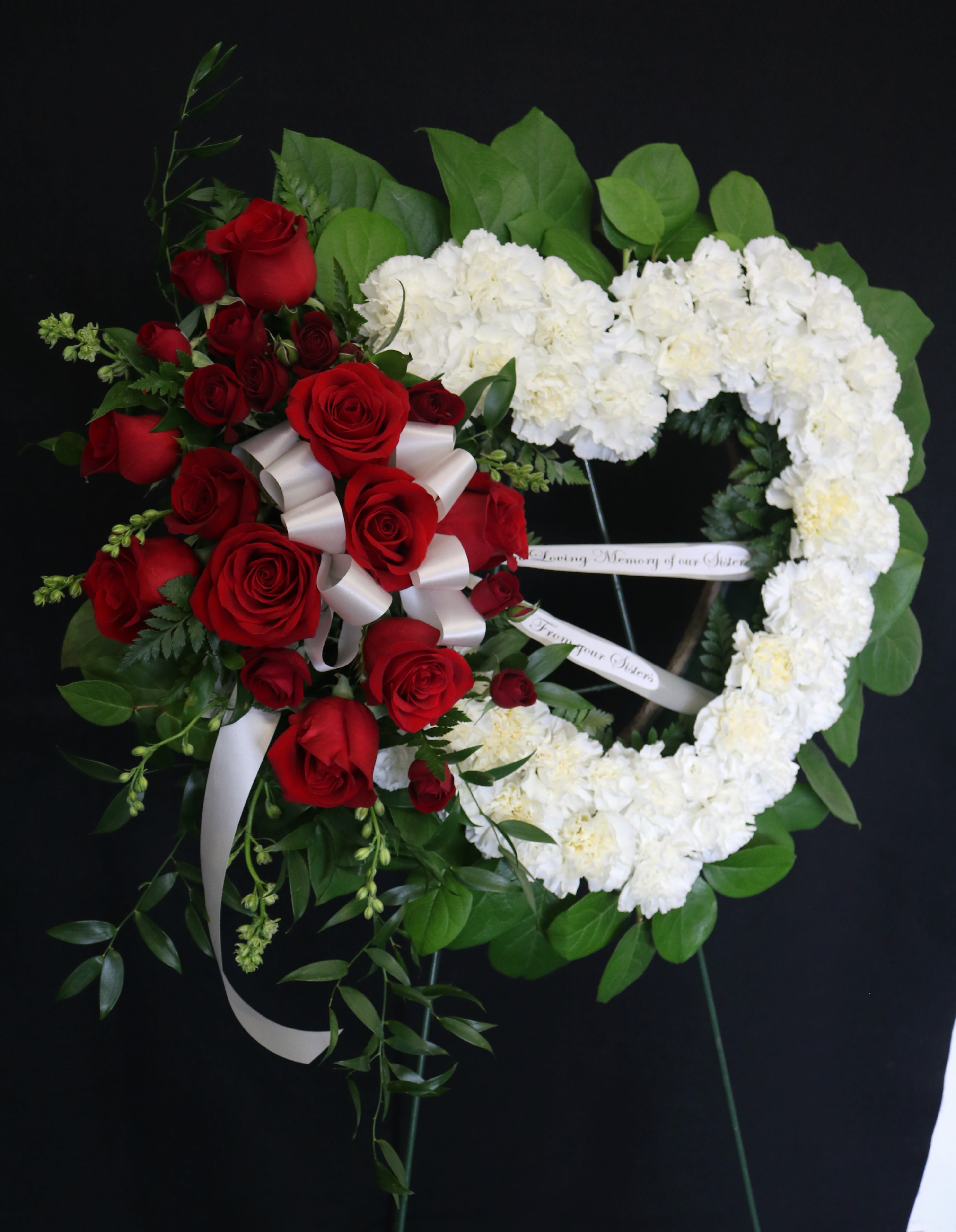 White Open Heart with Red Rose Swag White Open Heart with Red Rose Swag - 18 inch open heart design. The premium size is 24 inches.