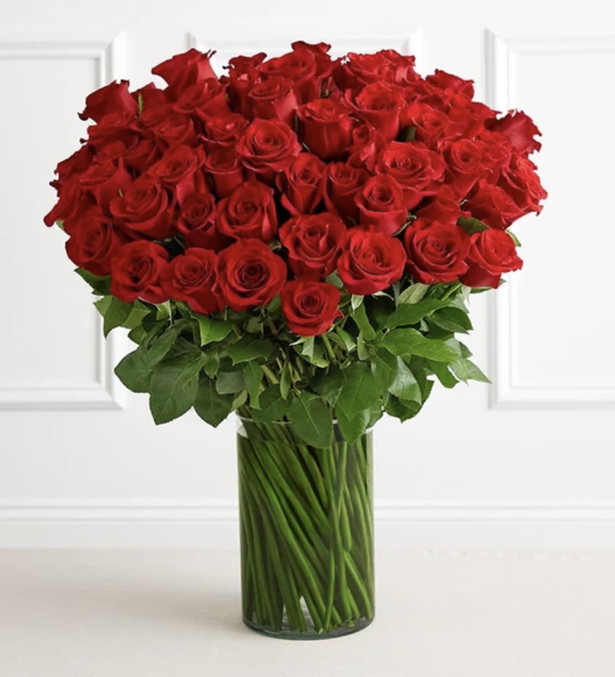 Spectacular Rose 100 Stem Red Roses Vase Arrangement - LIMITED QUANTITIES Give the ultimate WOW this Valentine’s with a gift of floral luxury. We’ve gathered 100 stem red roses, grown and picked at their peak, then hand-selected for their size and beauty. Presented in a classic glass cylinder vase, the stunning arrangement says “I love you” as no other gift can. 