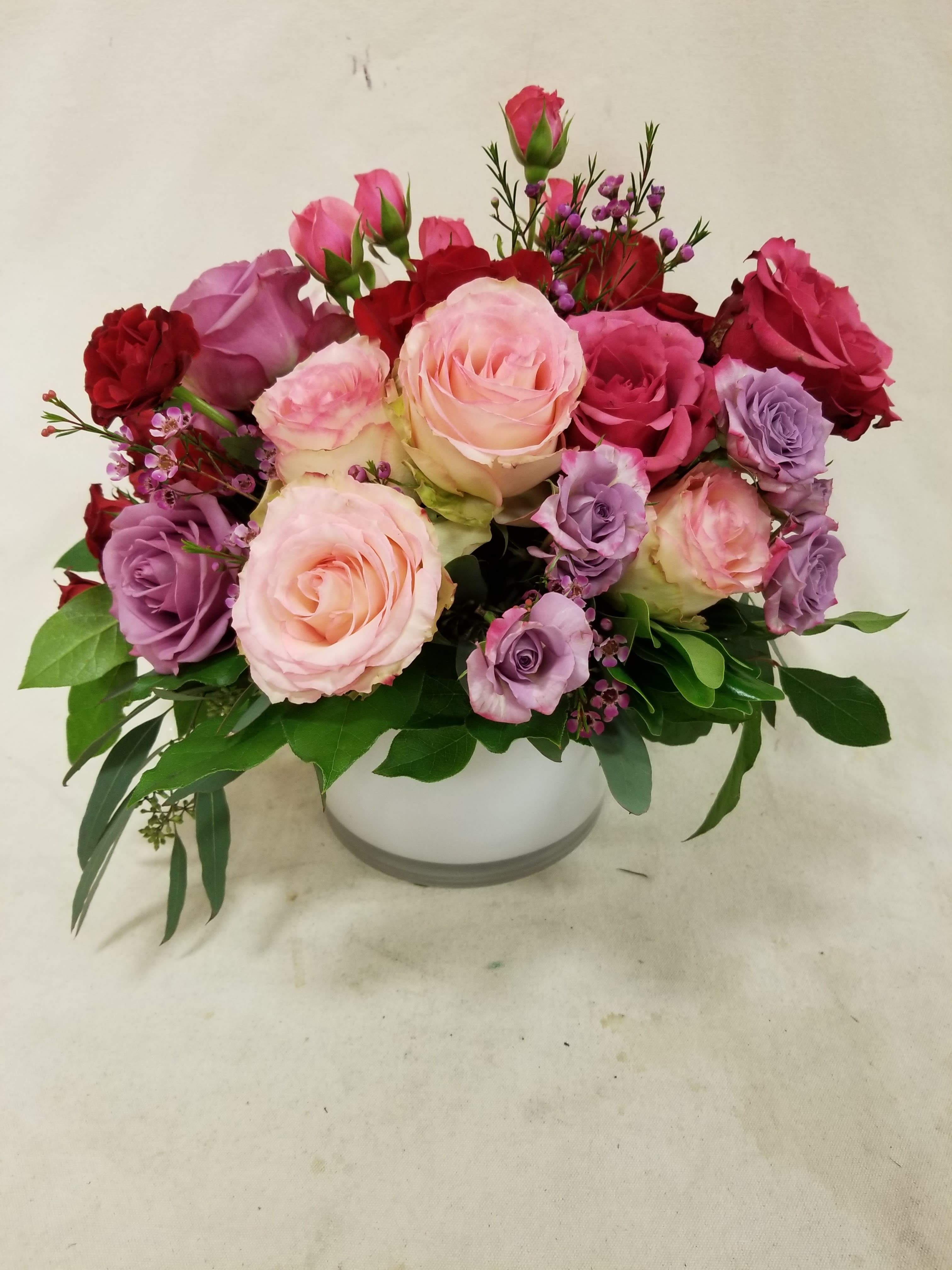 &quot;Roses Roses Roses!&quot; Bouquet - A gorgeous assortment of premium roses in a glass cylinder. Every different size and color on hand is used to create a kaleidoscope of love. Truly spectacular.