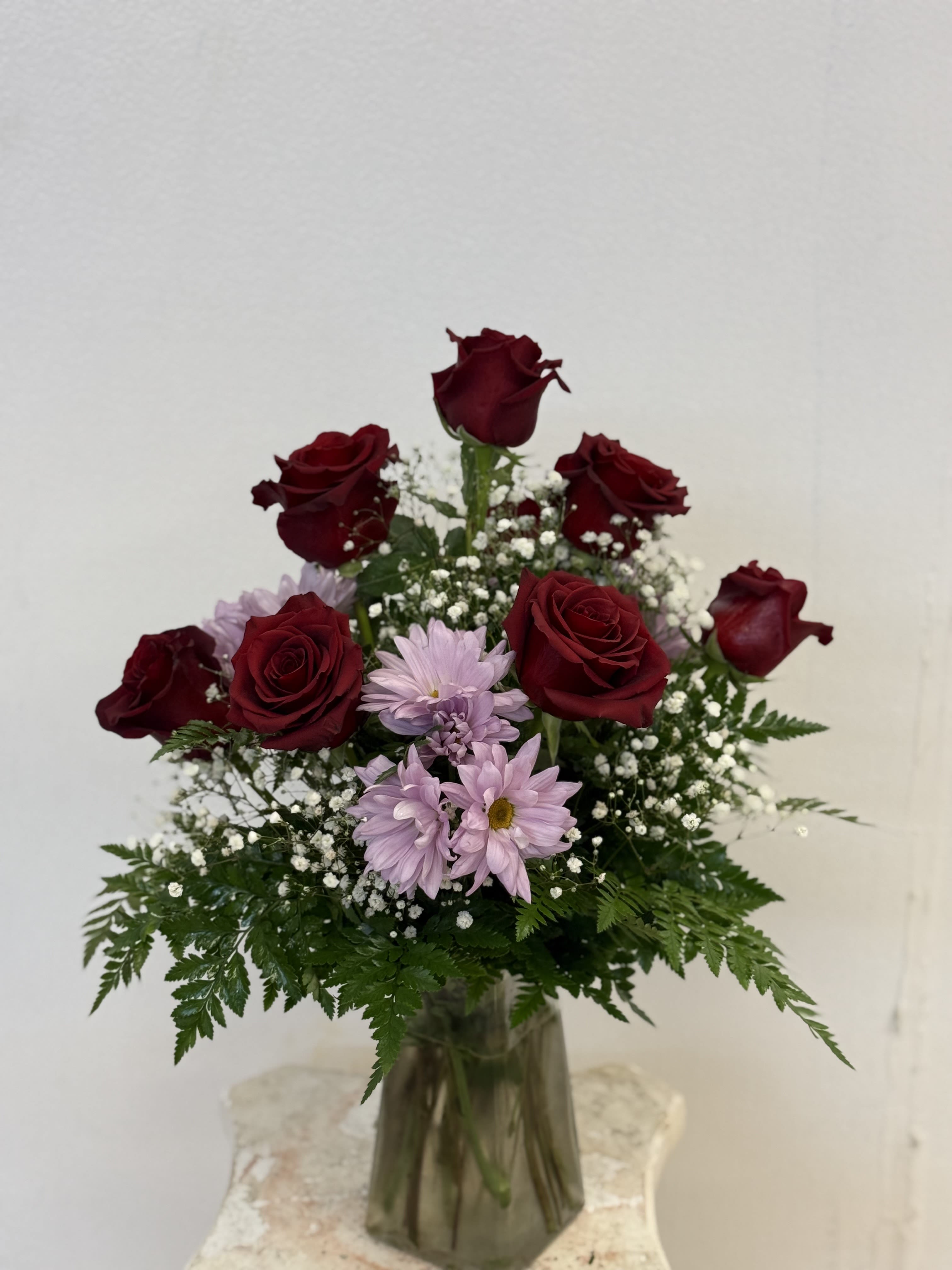 Everyday Arrangement Everyday Arrangement - Medium size arrangement with 8 red roses in a glass vase with filler.