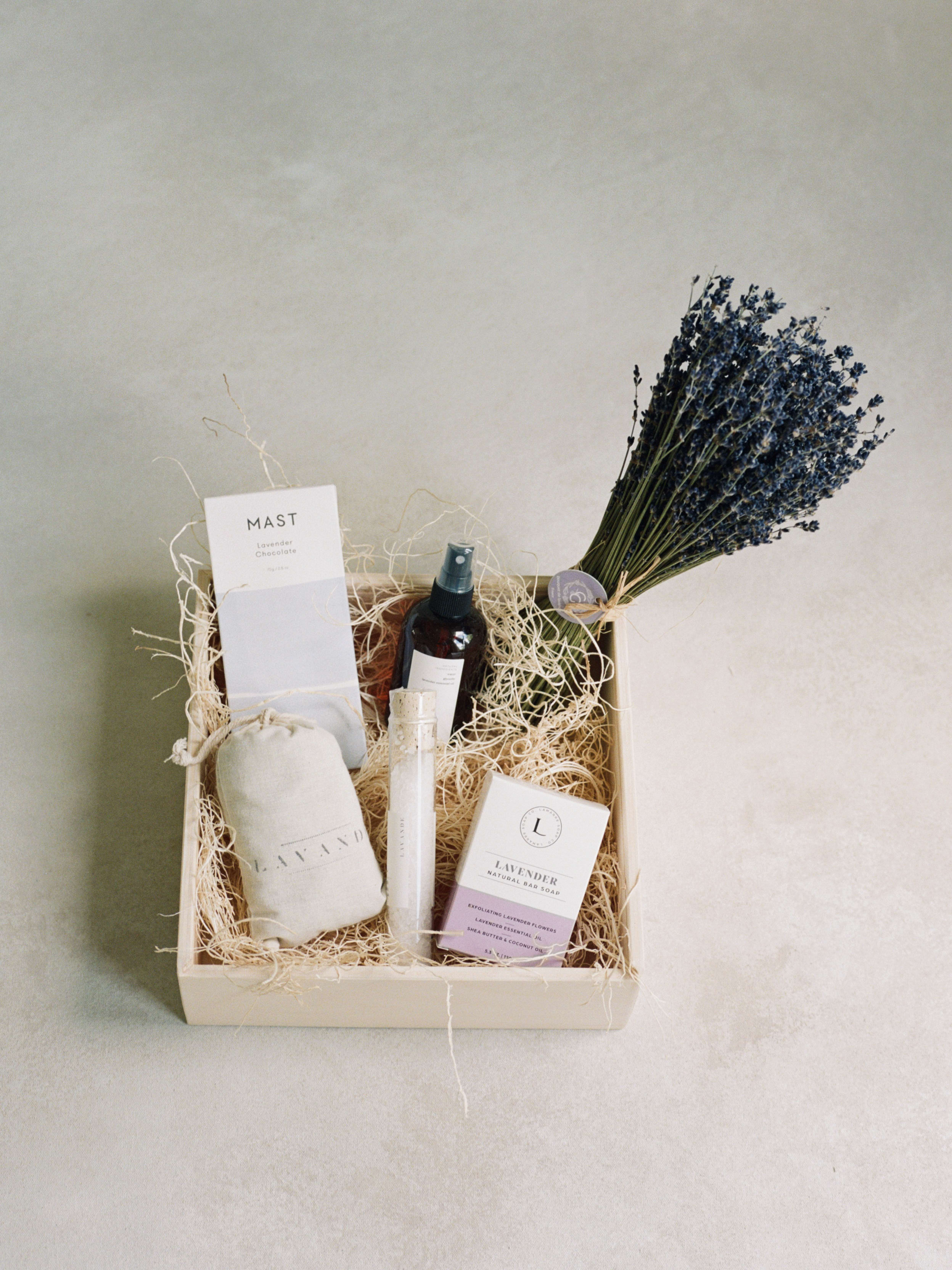 The Lavender Gift Box The Lavender Gift Box - The perfect relaxing gift. A lavender chocolate bar, lavender bar soap, lavender dried bundle, lavender sachet, Lavender mosquito spray, and bath salts, all designed in a wooden keepsake box with a handwritten card.