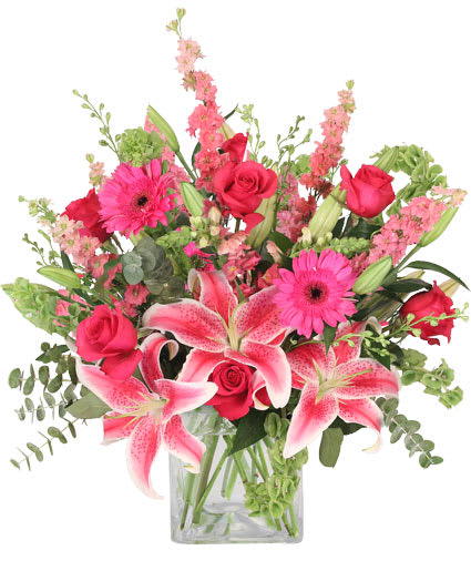 Pink Explosion Arrangement Pink Explosion Arrangement - Make an unforgettable declaration of love with this striking bouquet! With vibrant pink roses, gerberas, Stargazer lilies, and Snapdragons, this arrangement is truly an explosion of love. Radiant and glamorous,