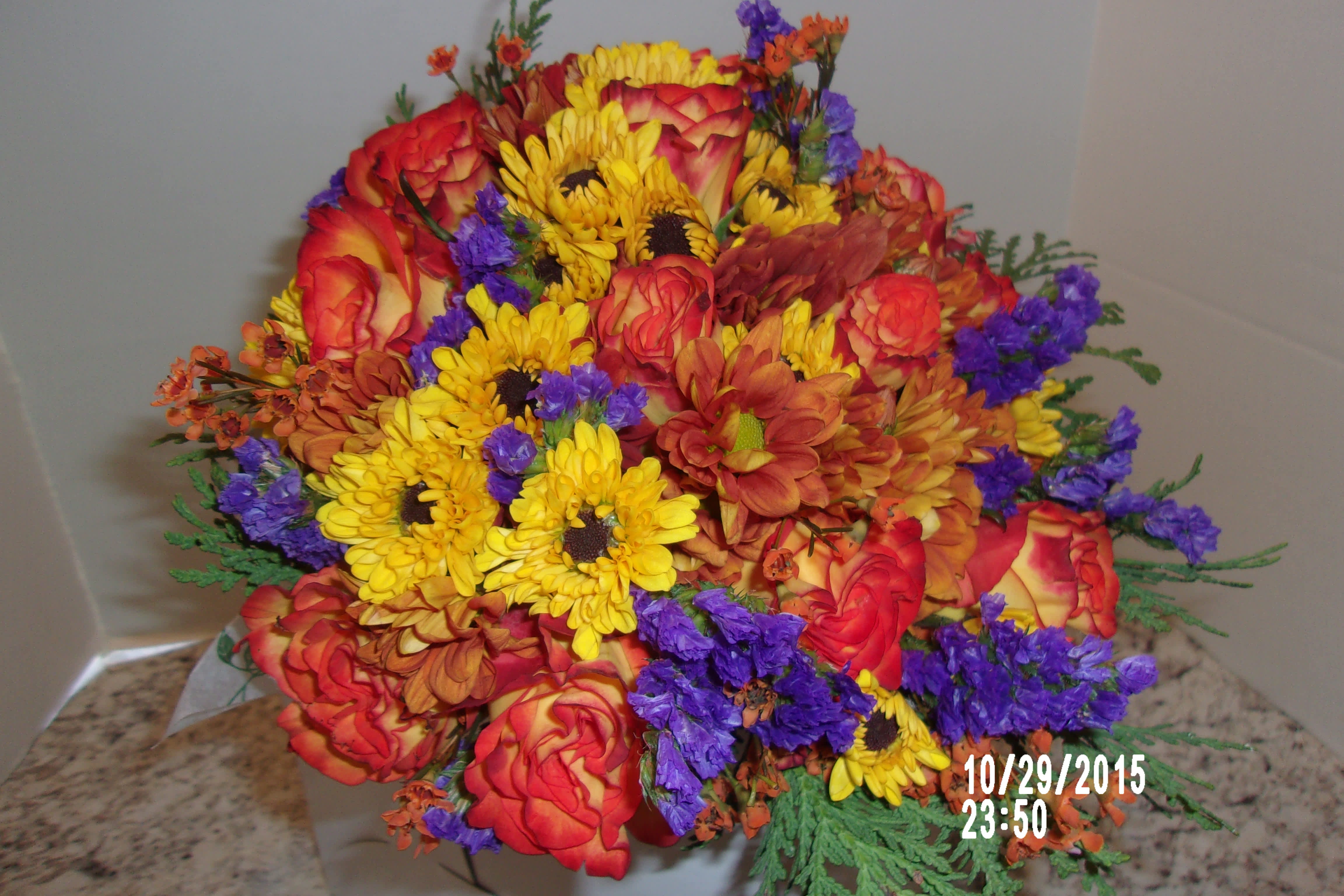 fall wedding bouquet fall wedding bouquet - A dozen bi-color orange roses along with fall daisies and mums and a pop of purple makes this brides bouquet the perfect accompaniment for a fall wedding.100-