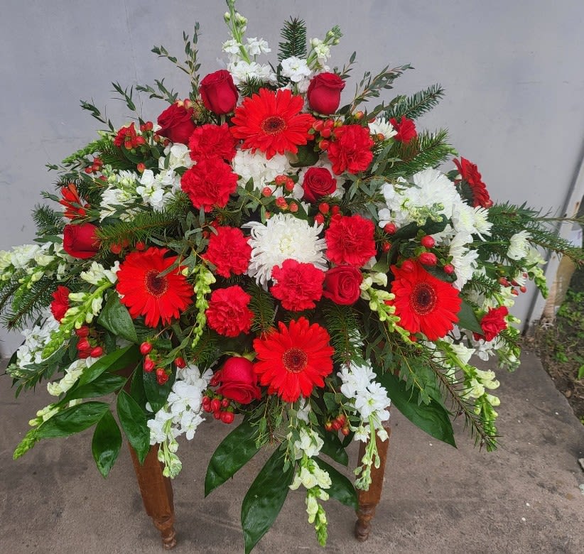 " Strength & Wisdom Casket Spray" By Katherine's Flowers " Strength & Wisdom Casket Spray" By Katherine's Flowers - This beautiful red & white spray will deliver strength and wisdom to know brighter days are ahead. Dazzling red roses and gerberas, brilliant white create a strong yet soothing.