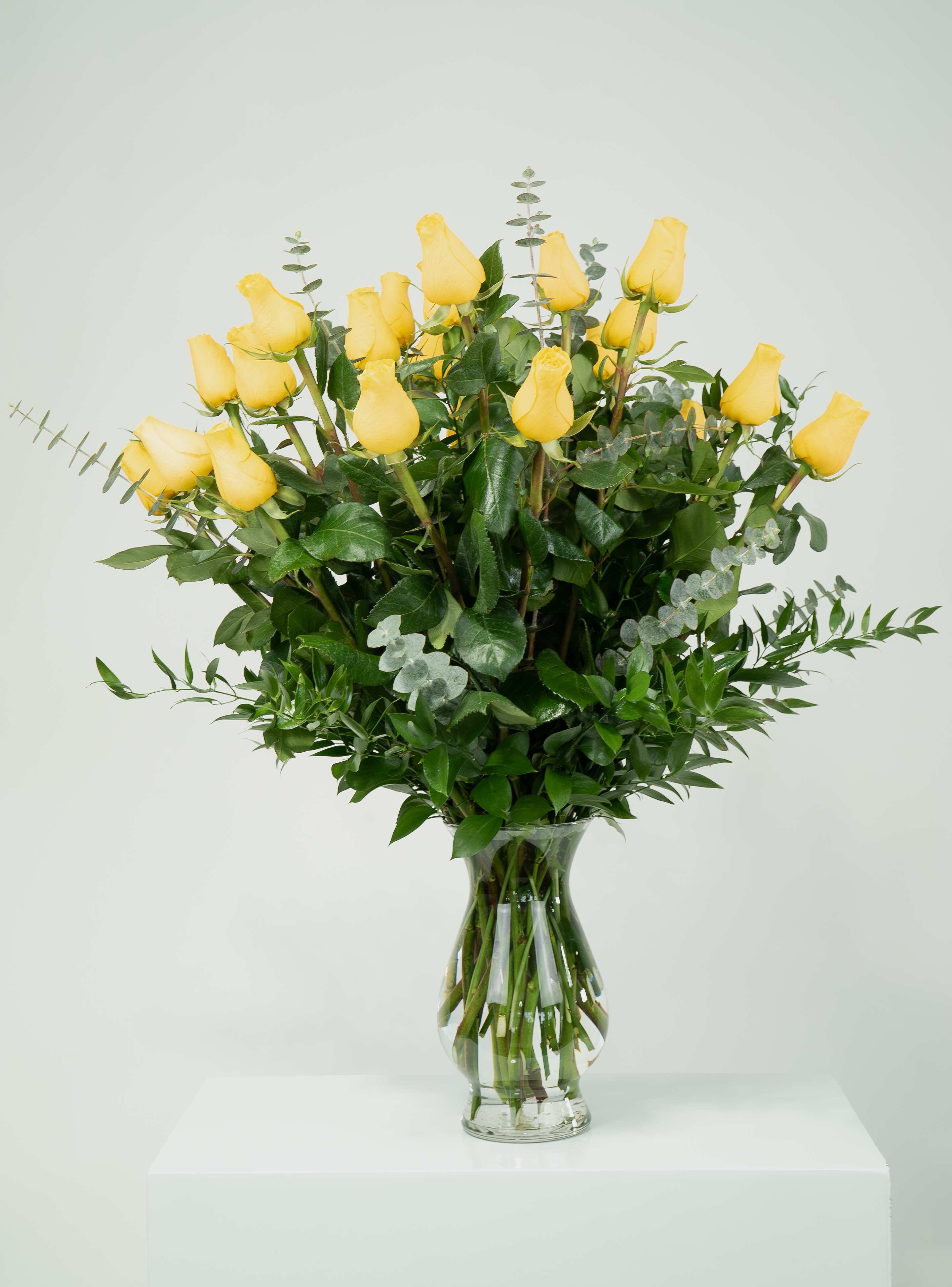Two Dozen Yellow Roses Two Dozen Yellow Roses - Bring sunshine inside with these beautiful 24 long stem yellow roses. A sure way to send bright love that they will be able to see from every corner of the room.
