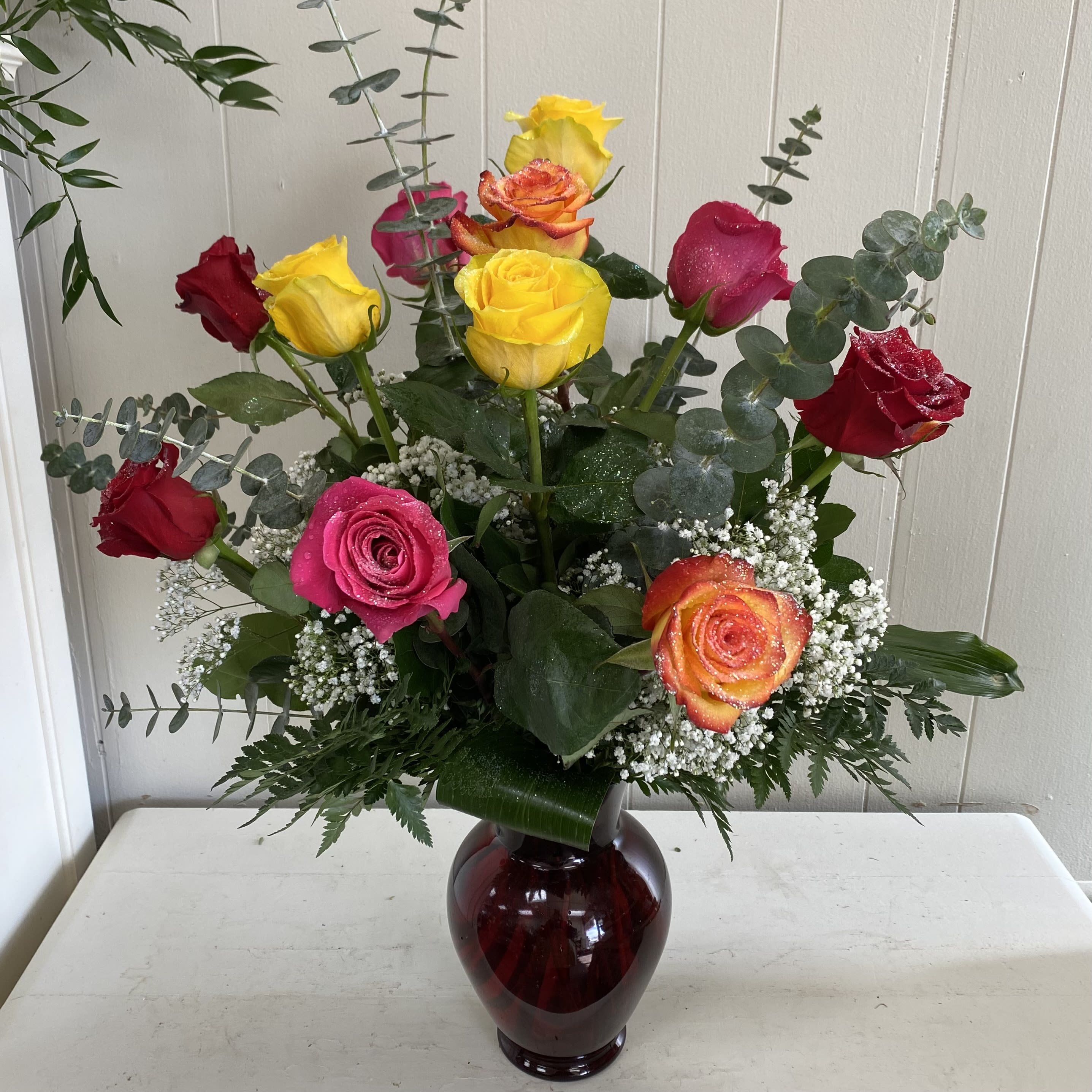 Lovely Rose Assortment Lovely Rose Assortment - Surprise them with a unique mix of assorted colored roses artfully arranged in a glass vase with mixed foliages and accent flowers