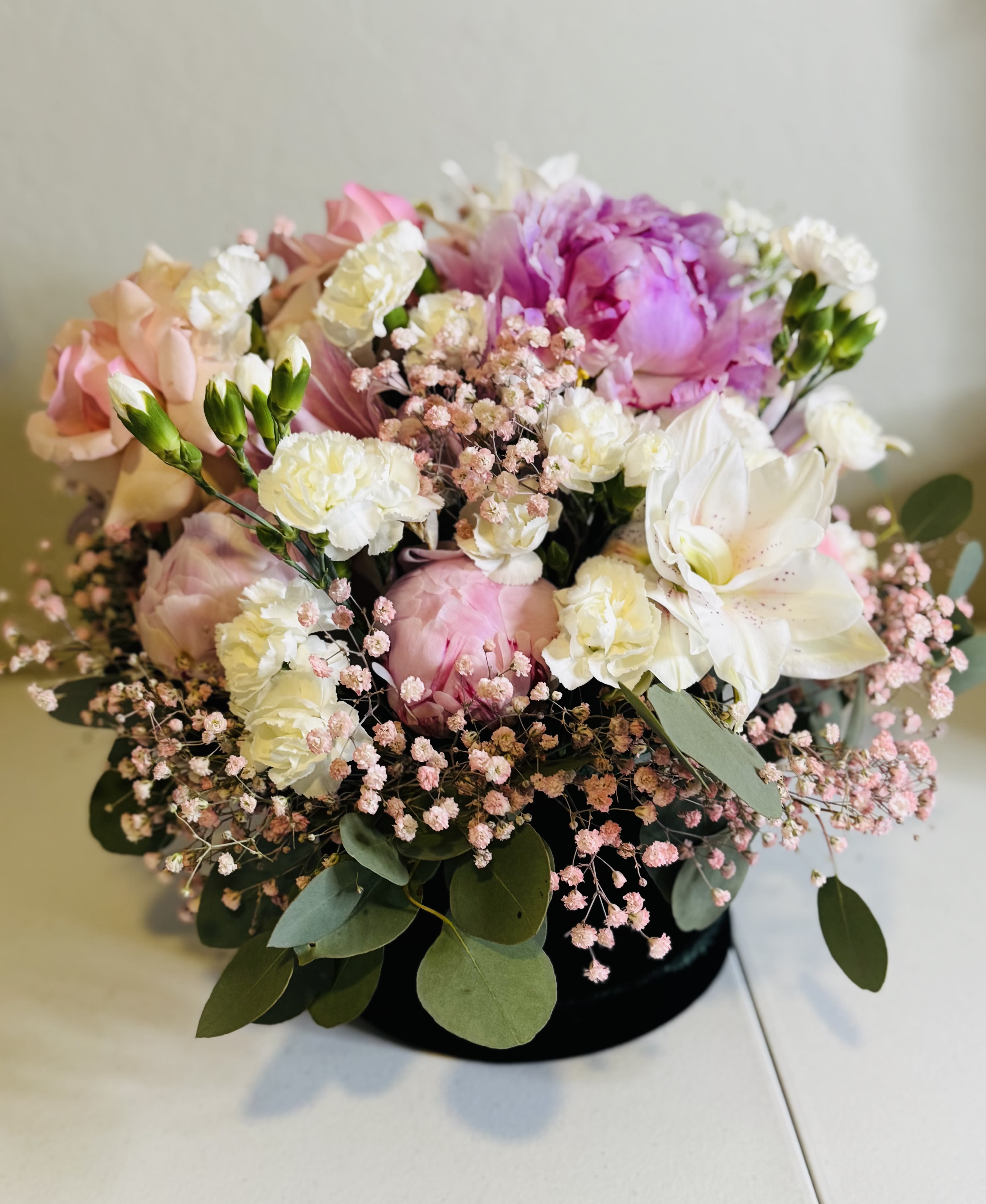 Black Velvet - A beautiful mix of premiums florals including Peonies, Pink Roses, Spray Roses, Pink Lillie’s, Pink Baby’s Breath &amp; eucalyptus tucked in a black velvet box with custom branding 