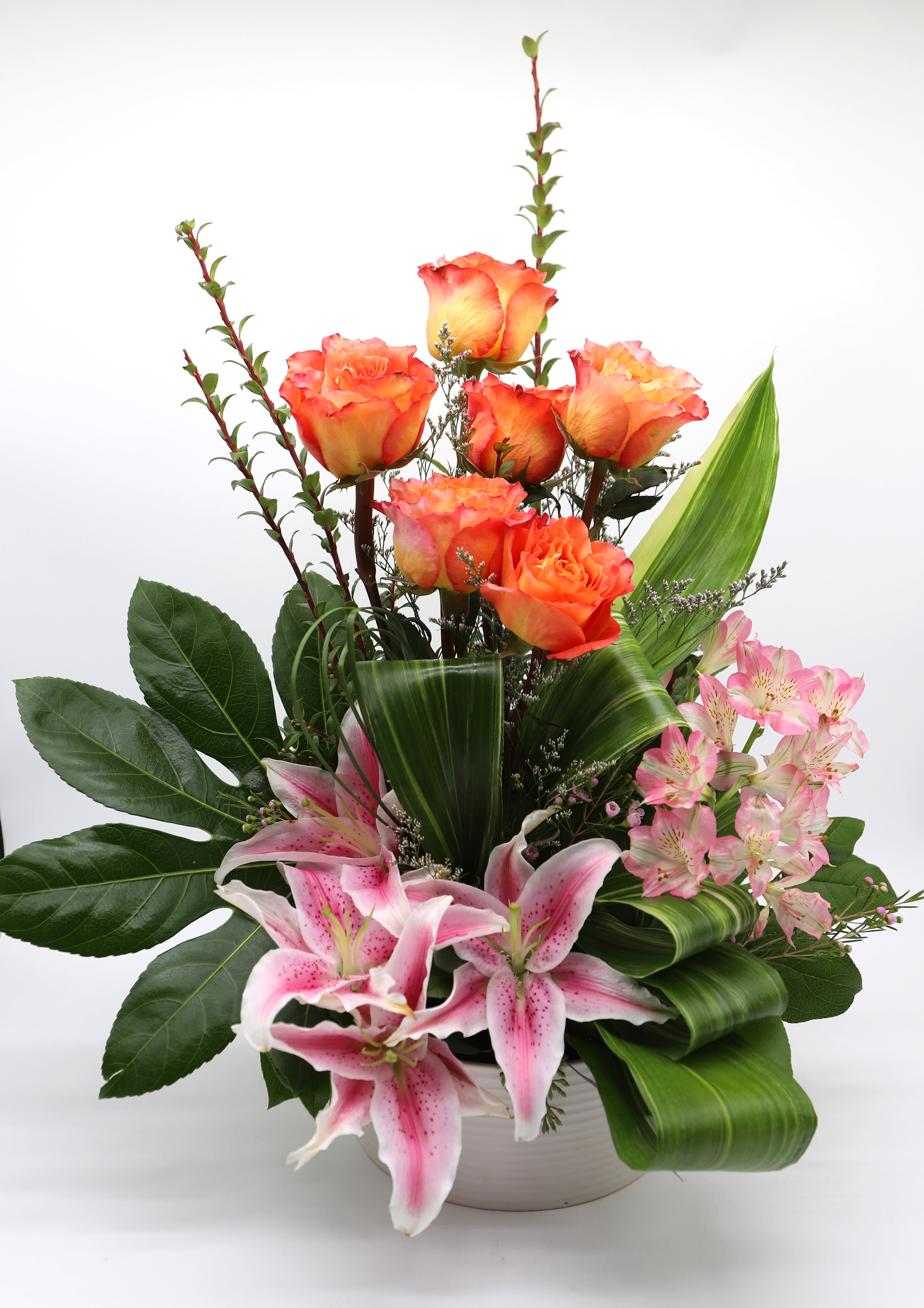 Tropical Stargazing - This stunning arrangement includes, stargazer lillies, alstromerias, and bicolor roses with greenery that adds the perfect tropical touch.