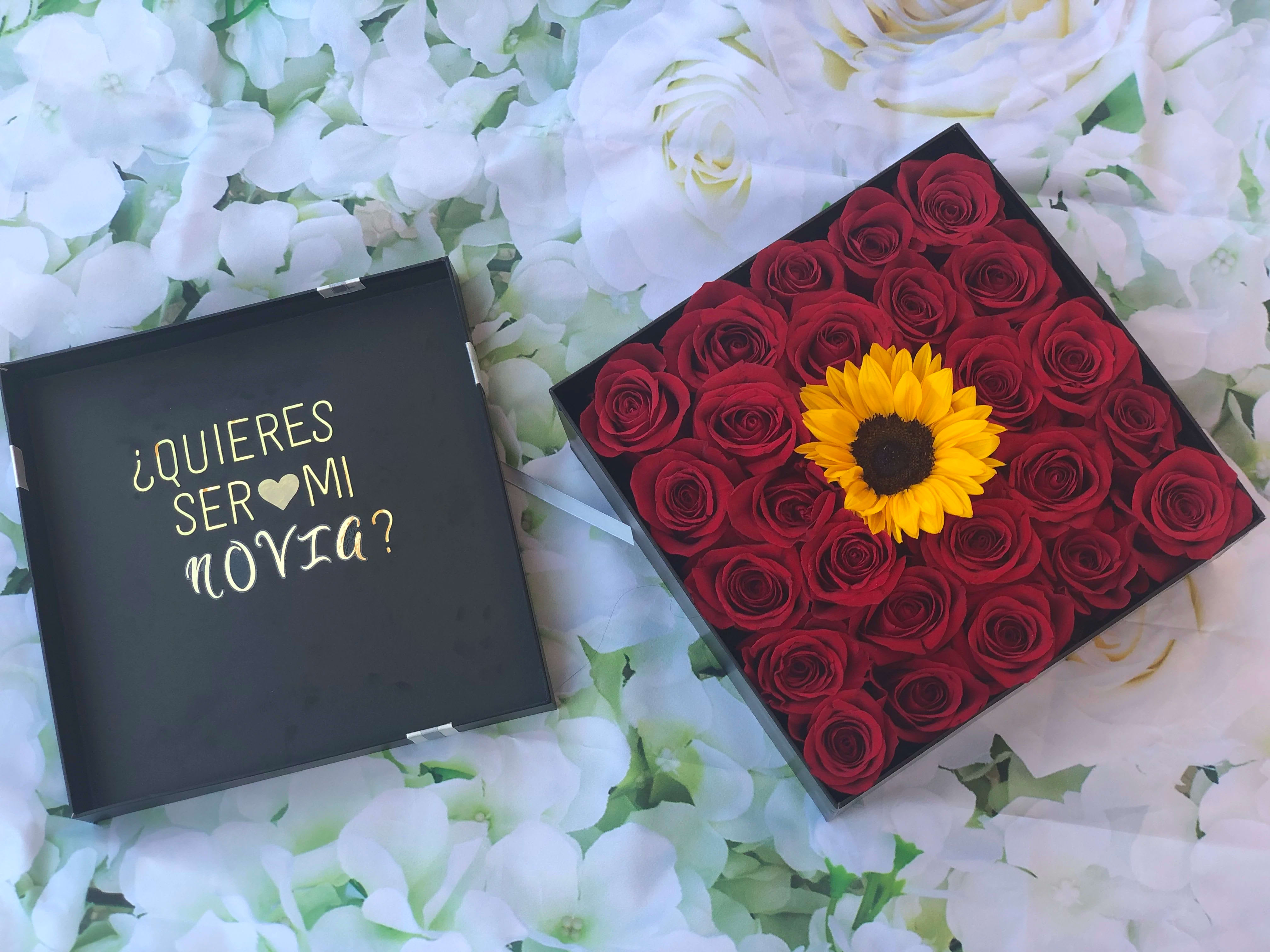 Red roses in a box - 24 red roses one sunflower, with a loving message, gold stickers.