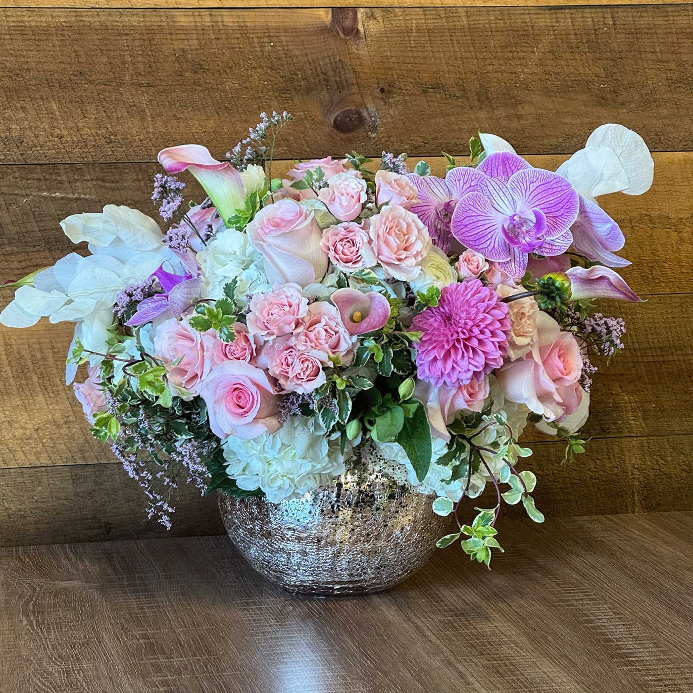 Rosa de Oro - Rosa de Oro - Contains : Roses, Spray Roses, Hydrangeas, Orchids, Greenery, Fillers, Mini Callas (if in season), Dahlias ( if in season) in gold vase.