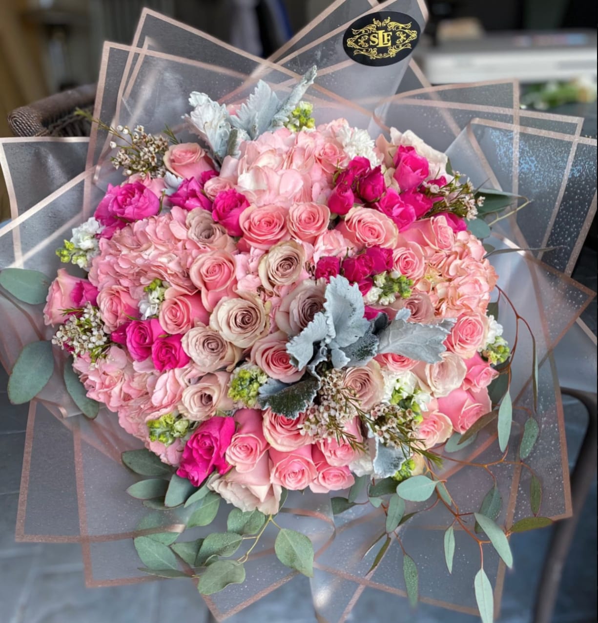 Charmed Essence Charmed Essence - Brighten any space with our Elegant Flower Bouquet! Bursting with vibrant blooms, this stunning arrangement features seasonal favorites paired with lush greenery for a breathtaking display. Perfect for any occasion, it makes an ideal gift or a special treat for yourself. Elevate your decor with this captivating bouquet that brings joy and sophistication to your home or office. Order yours today and let the beauty of flowers inspire you!