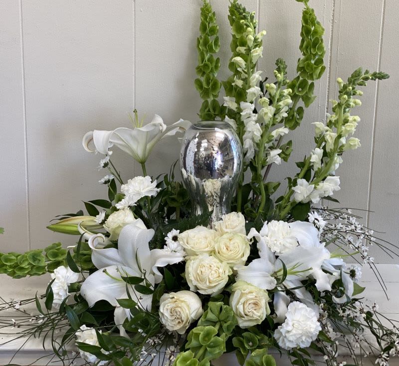Peaceful Urn Surround Peaceful Urn Surround - A subtly hued garden expresses sympathy most thoughtfully, in a gentle gardeny arrangement that honors and embraces a cherished memory.
