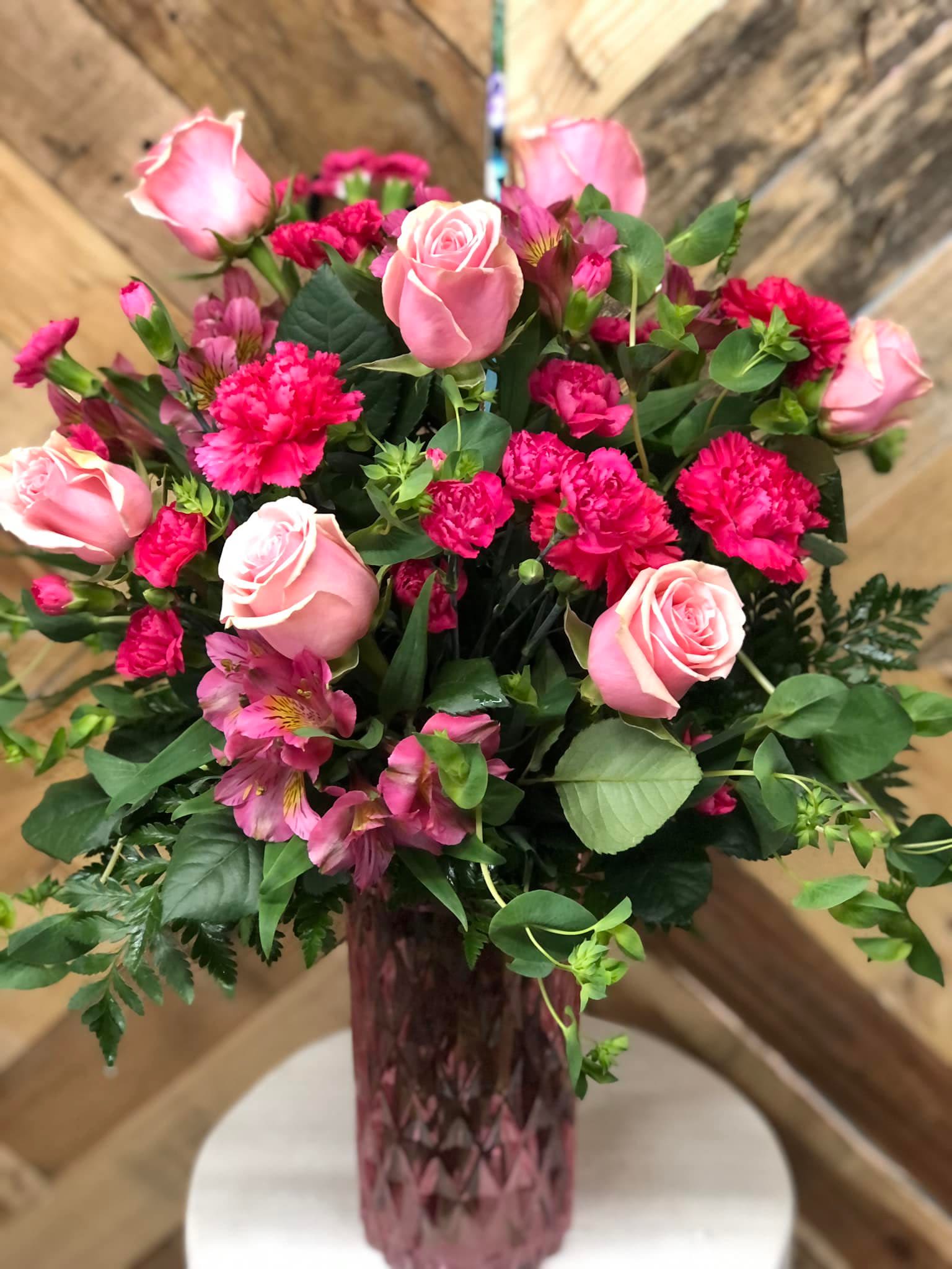 Strawberry Sunset - Strawberry Sunset includes light pink roses, hot pink carnations and hot pink mini carnations, alstroemeria lilies, and mixed greenery.