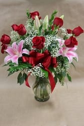 Elegance Bouquet Elegance Bouquet - A stunning collection of one dozen red roses and pink stargazer lilies designed in a clear glass vase.