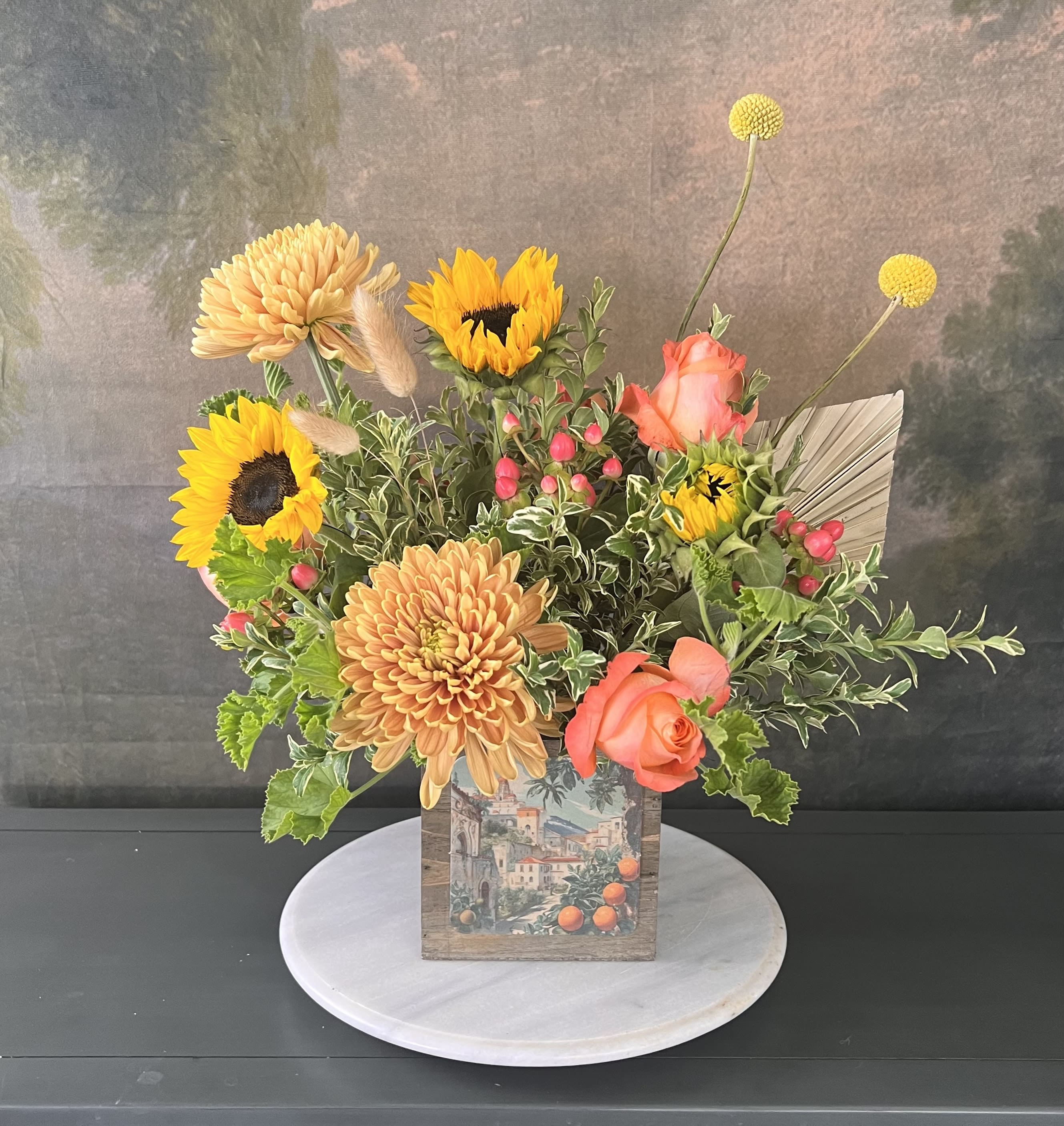 Riverside Mission Inn - Bright and cheerful with summer’s best seasonal flowers, this custom handmade wood box is detailed with a unique Riverside specific label. Our most popular arrangement is perfect for birthdays, anniversaries, and anything else you can think of!  Flowers and greenery may vary due to seasonal availability, but that’s part of the charm! Our creative designers will substitute with the freshest high end product available- some grown in our very own garden!- and create something beautiful.  *Have a special request?* Let us know in the special instructions section during checkout.