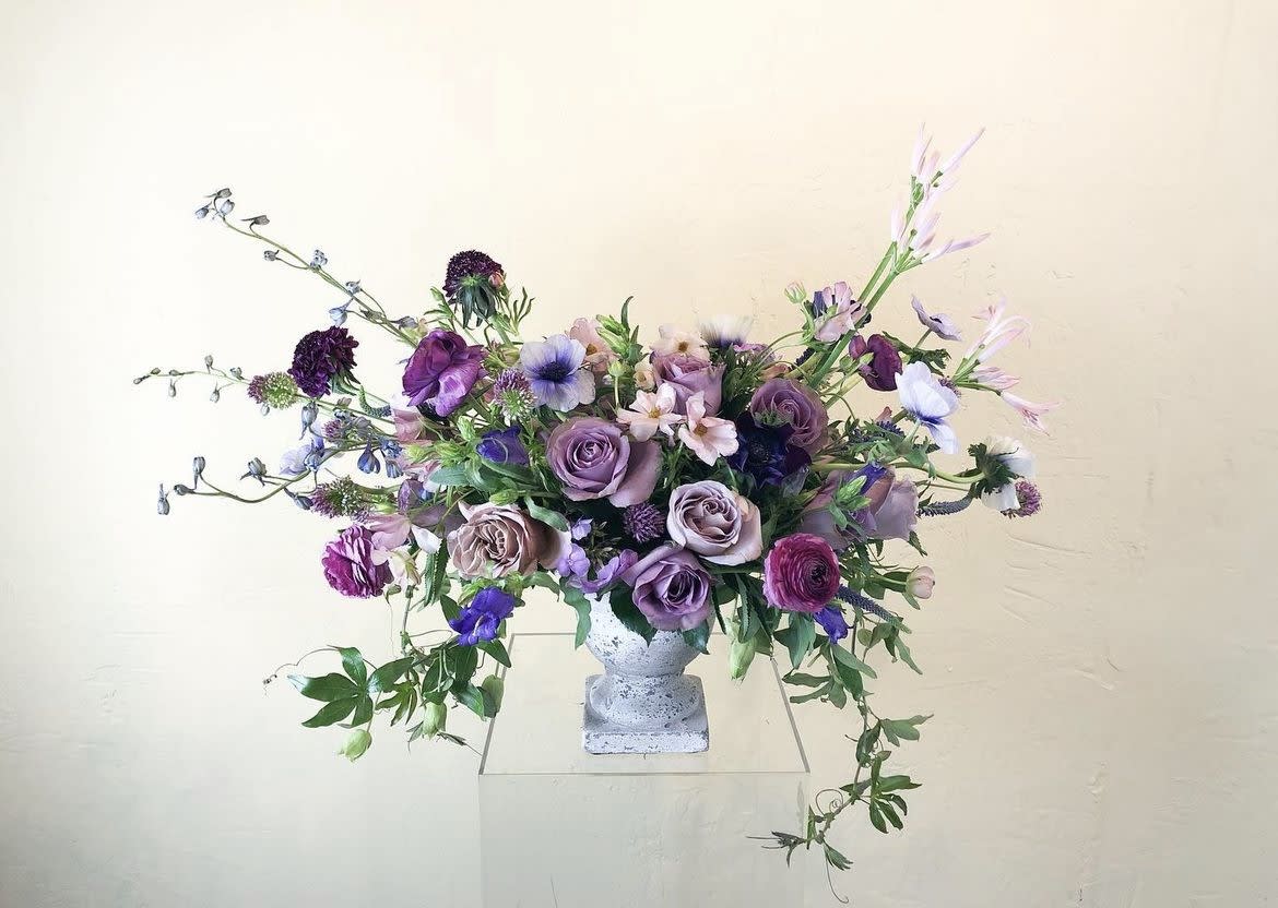Keely - A seasonal lavender and plum mix of gorgeous high end florals comes together perfectly in this one of a kind arrangement. Designed in a high end ceramic vase, this collection is perfect for any occasion and certain to impress!  Flowers and greenery may vary due to seasonal availability, but that’s part of the charm! Our creative designers will substitute with the freshest high end product available- some grown in our very own garden!- and create something beautiful.  *Have a special request?* Let us know in the special instructions section during checkout.