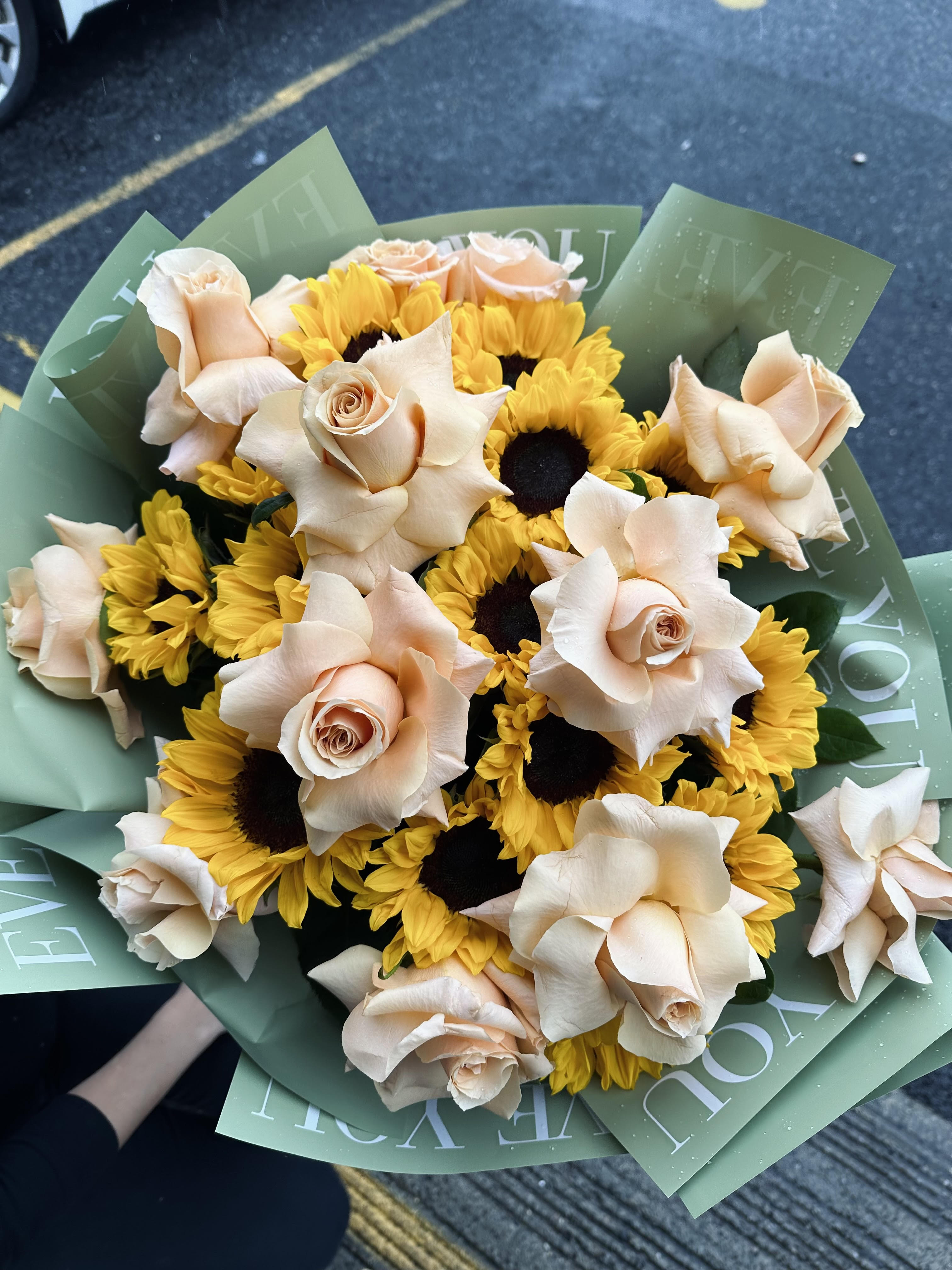 You Are a Sunflower  - 14 Sunflowers &amp; one dozen Roses in modern wrapping. Substitution for rose color is available. 