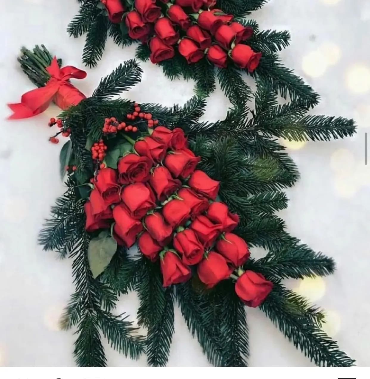 Christmas Tree Bouquet Christmas Tree Bouquet - A bouquet shaped as a christmas tree with rows of red roses and pine around it. Only available for the holidays.