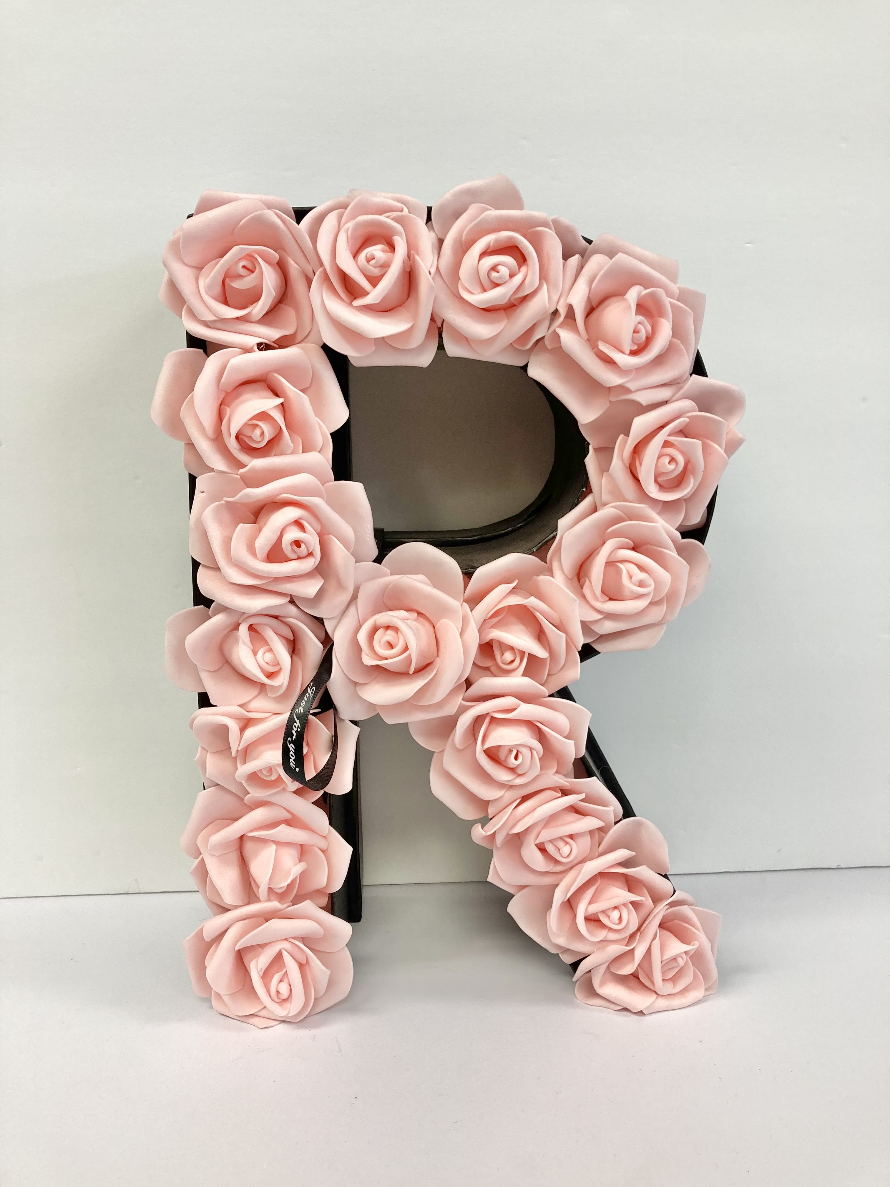 Floral Letter Box (R) Floral Letter Box (R) - A letter shaped box filled with artificial flowers. We can make this in different colors such as white and red as well as other letters. Please leave a note or call us to make adjustments