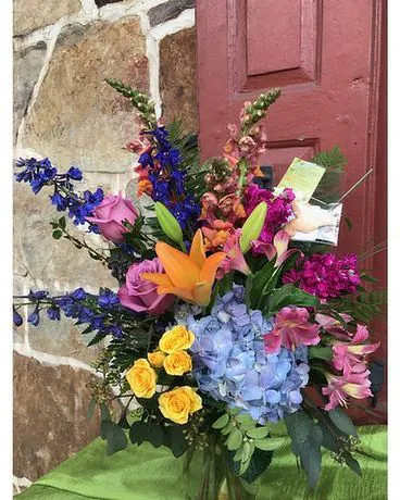 Colors Of The Rainbow Colors Of The Rainbow - Color any occasion beautiful with this lovely bouquet of hydrangea, roses and lilies in all the colors of the rainbow.