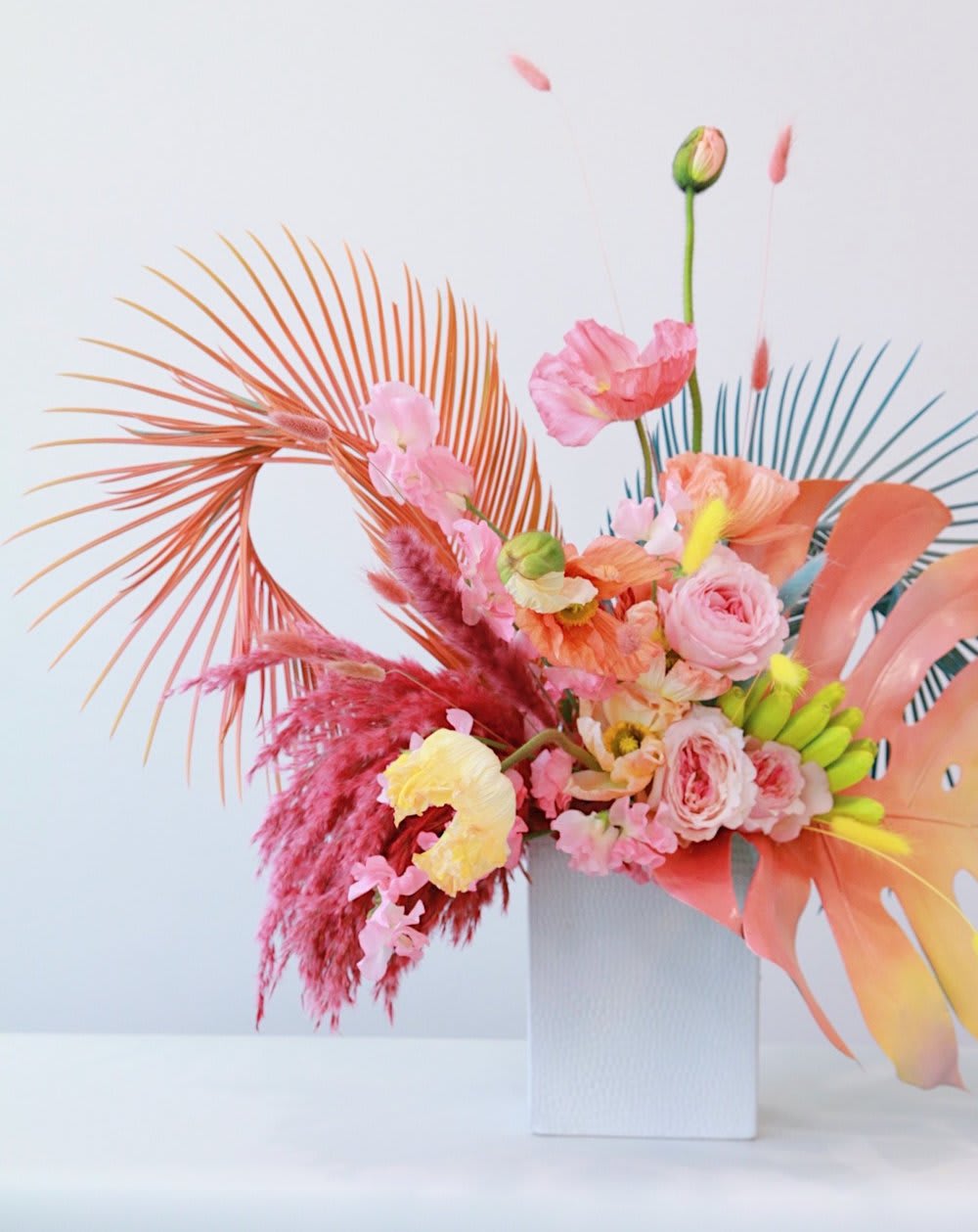 SUNSET BLVD -  - Vibrant hues of orange, yellow, and pinks - Reminiscent of a sunset over a lush paradise.