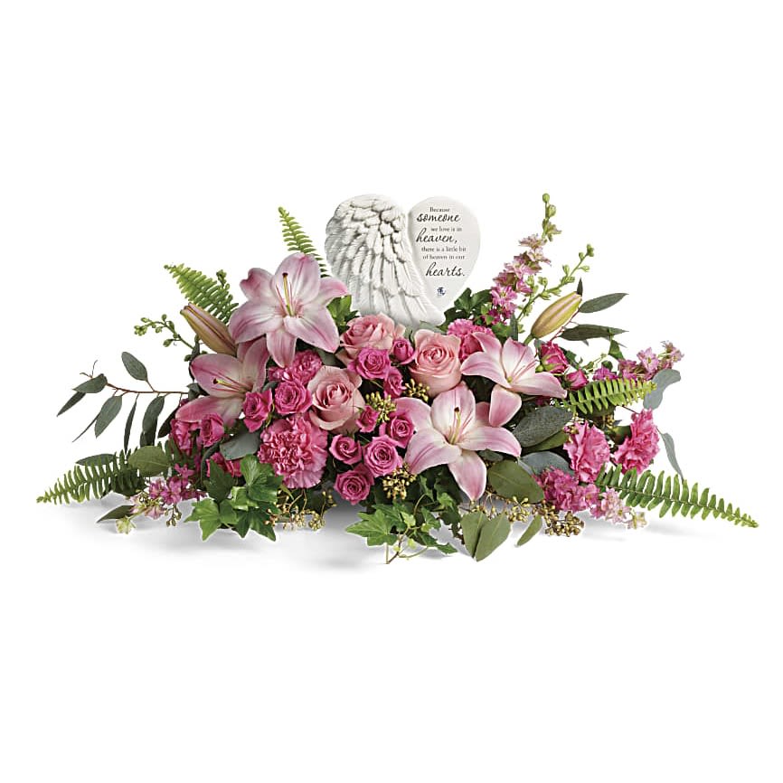 Heartfelt Farewell Bouquet - Say a heartfelt farewell to a loved one with this touching porcelain keepsake, nestled in a bouquet of the prettiest pink roses and lilies. This heartfelt bouquet includes pink roses, pink spray roses, pink asiatic lilies, pink carnations, pink larkspur, green ivy, seeded eucalyptus, silver dollar eucalyptus, and sword fern. Delivered with The Heaven's Heart Keepsake.