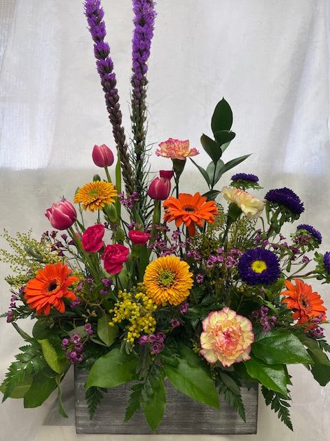 Donna's box of Spring Donna's box of Spring - Spring colors arrangement. Orange, red, purple, pink and greens.