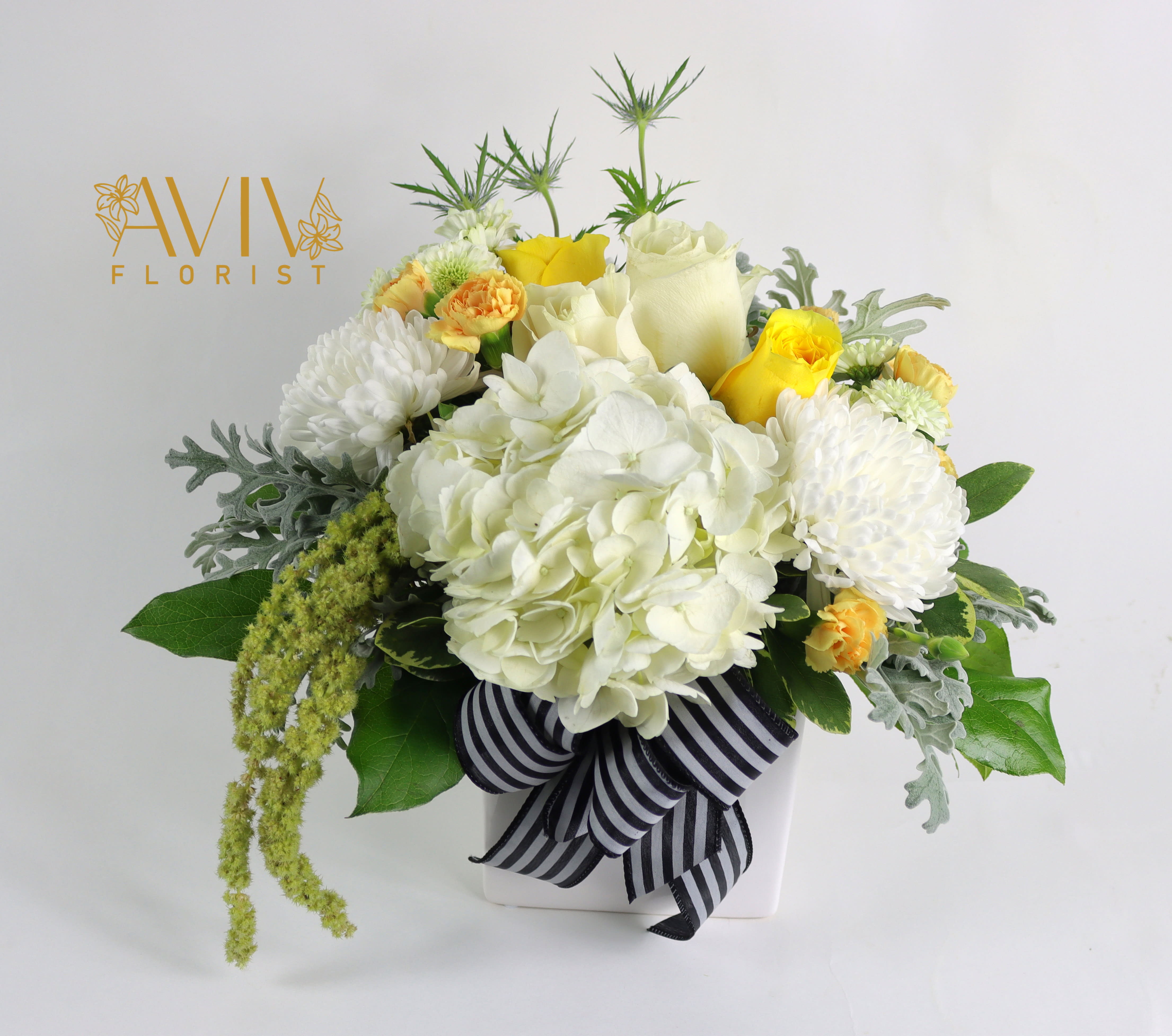 Right Feelings - This pretty arrangement classically elegant in a way that will never go out of style, this fresh flower arrangement is truly a dream.