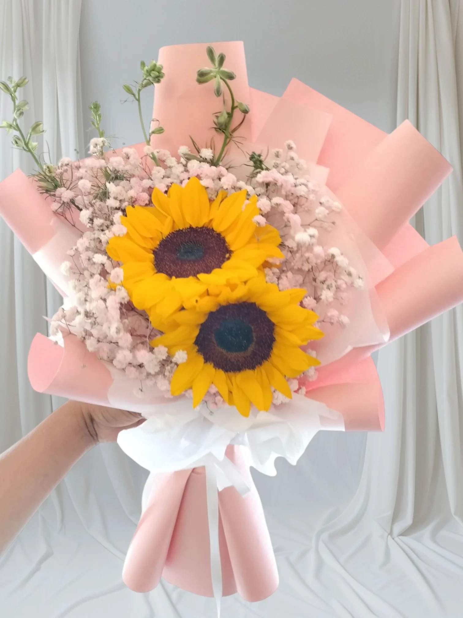 Simple You Bouquet Simple You Bouquet - 2 Large Sunflowers, babies Breath and green fillers nicely wrap in brown craft paper.