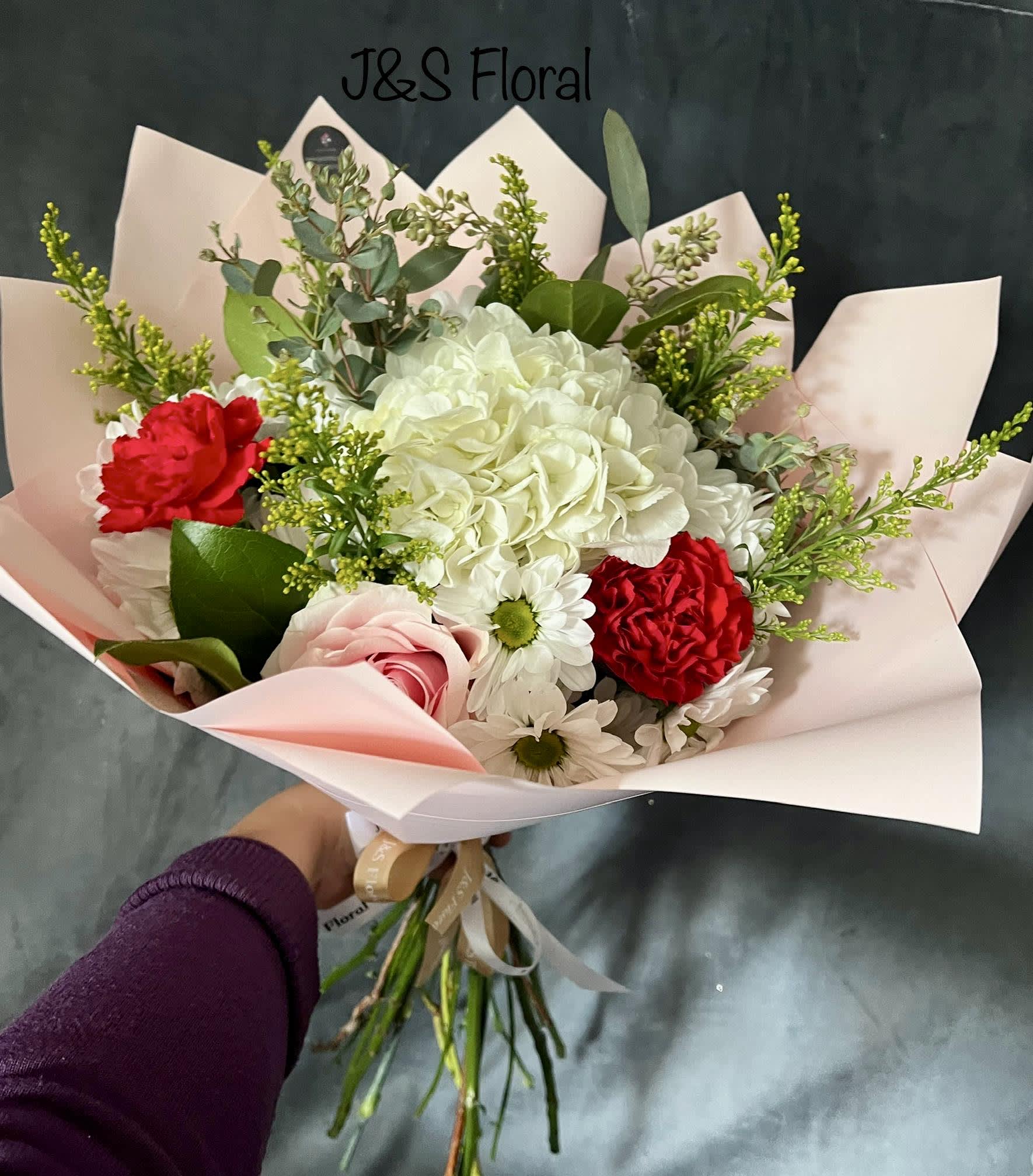 Aria Bouquet  - introducing Our New Design Aria hand tied bouquet, beautifully arranged with white hydrangeas, red carnation, pink roses, white daisies fillers and greenery
