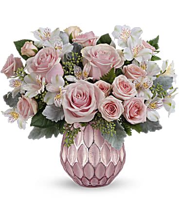 Pink Pastel Bouquet - DESCRIPTION VASE SIZES Soft and sweet, this pastel pink rose bouquet gets the glam treatment from a frosted glass vase with sculpted design and sparkling, faux mercury glass finish. This delightful bouquet features light pink roses, pink spray roses and white alstroemeria arranged with dusty miller, seeded eucalyptus and leatherleaf fern. Teleflora's Pink Pastel Bouquet is delivered in Teleflora's Pretty Love Vase. Orientation: All-Around  SUBSTITUTION POLICY – Always deliver the freshest flowers! Please note the bouquet pictured reflects our original design.  If the exact flowers or container in this arrangement are not available, our local florists will create a beautiful bouquet with the freshest available flowers. 