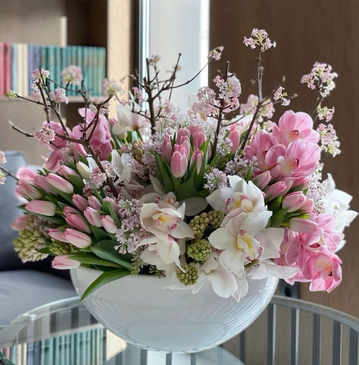 Pink in bloom - Large and stunning flower arrangement in ceramic vase elevate any space with vibrant blossoms. Pink tulips, spring branches, orchids, and greenery will brighten your day, bringing extra freshness to your home.
