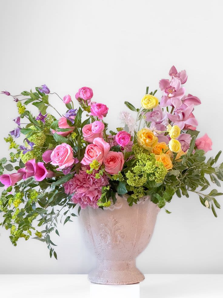 Pastel Garden Pastel Garden - Embrace springtime’s beauty with this mesmerizing flower arrangement featuring the season’s sweetest blush pink blooms. It’s a true celebration of spring and a stunning way to spread joy and happiness.
